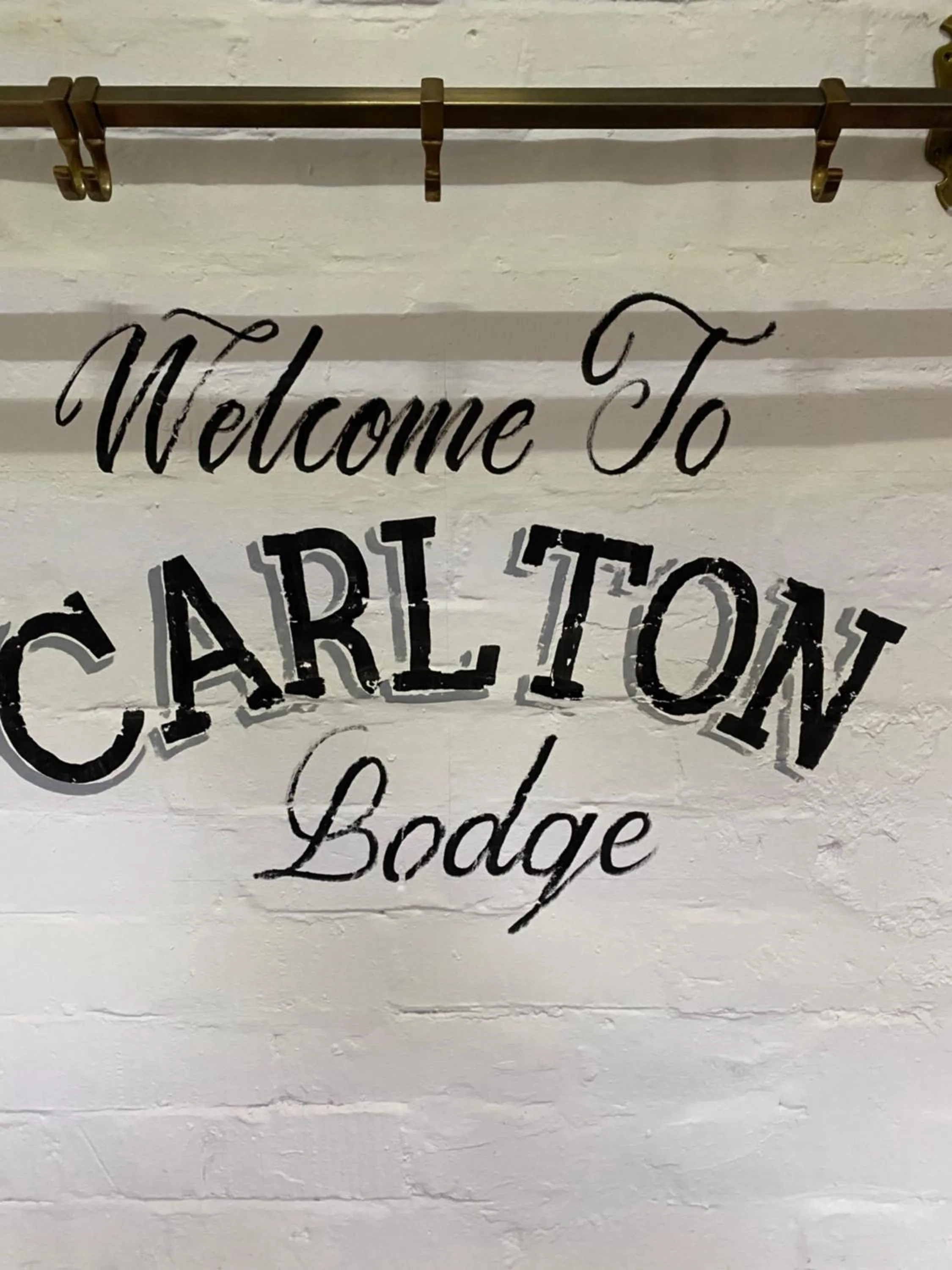 Property logo or sign in The lodge at Carlton tavern free parking