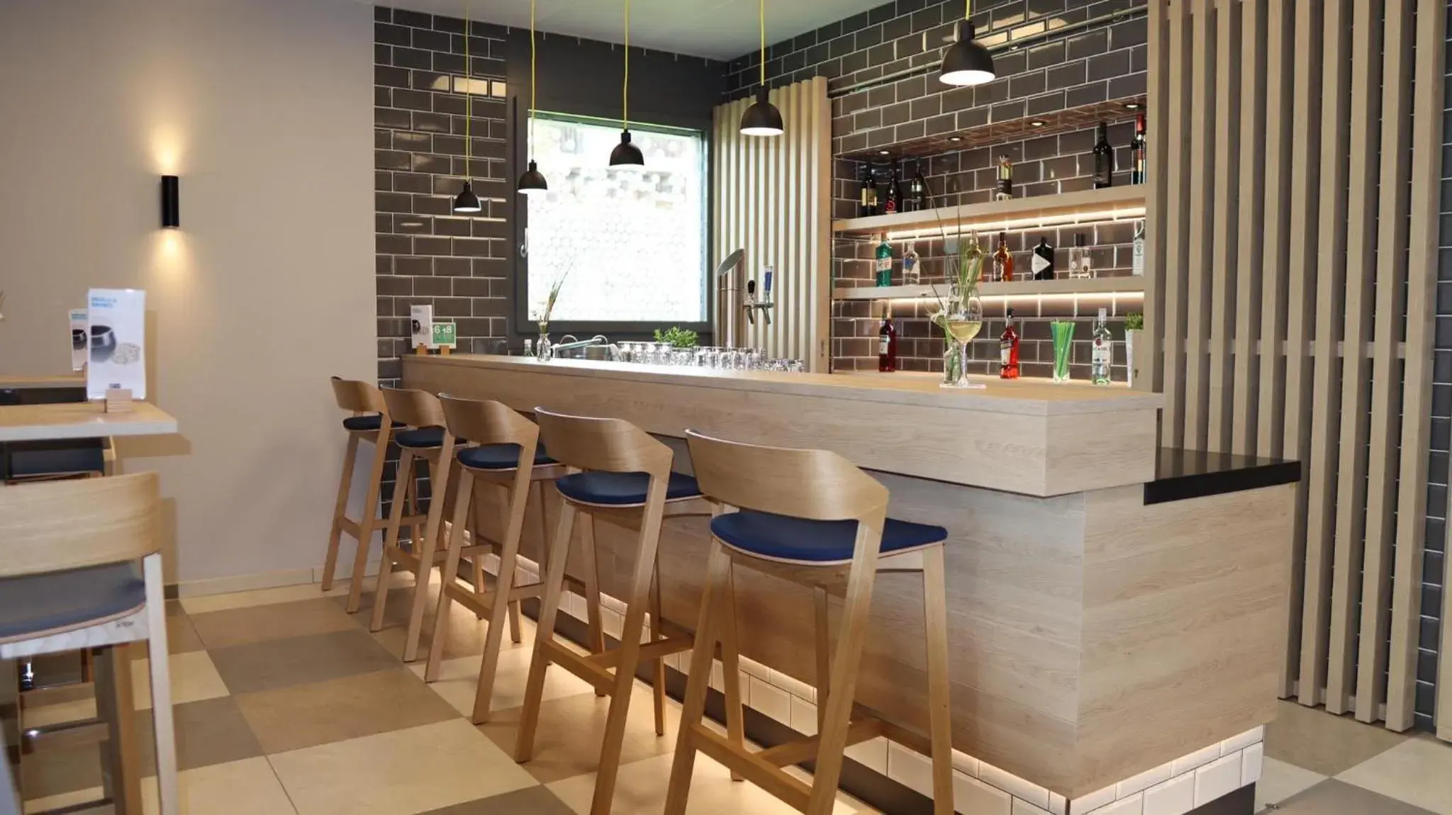 Lounge or bar in Holiday Inn Express Luzern-Neuenkirch by IHG Lounge or bar in Holiday Inn Express Luzern-Neuenkirch by IHG