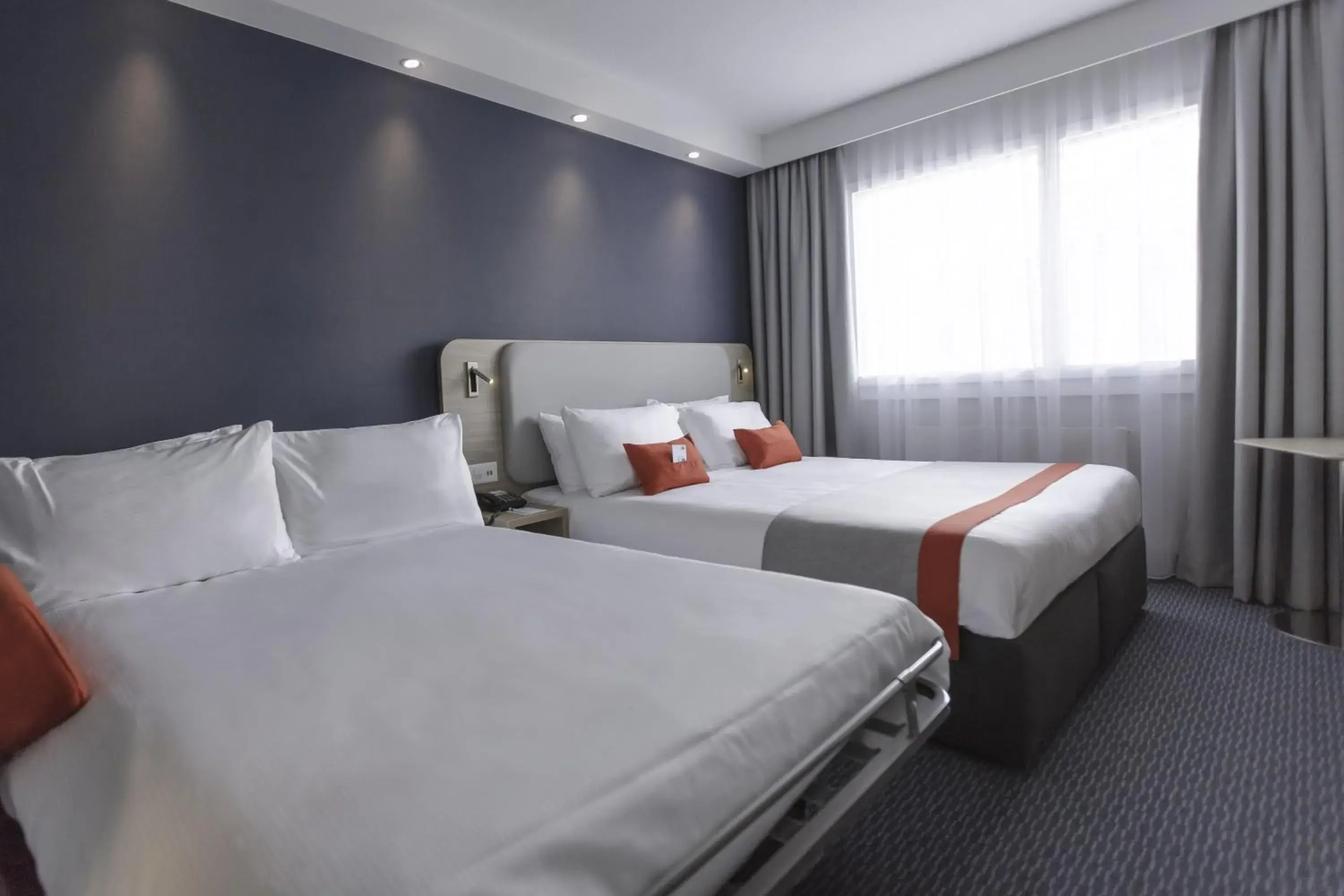 Photo of the whole room, Bed in Holiday Inn Express Luzern-Neuenkirch by IHG Photo of the whole room, Bed in Holiday Inn Express Luzern-Neuenkirch by IHG