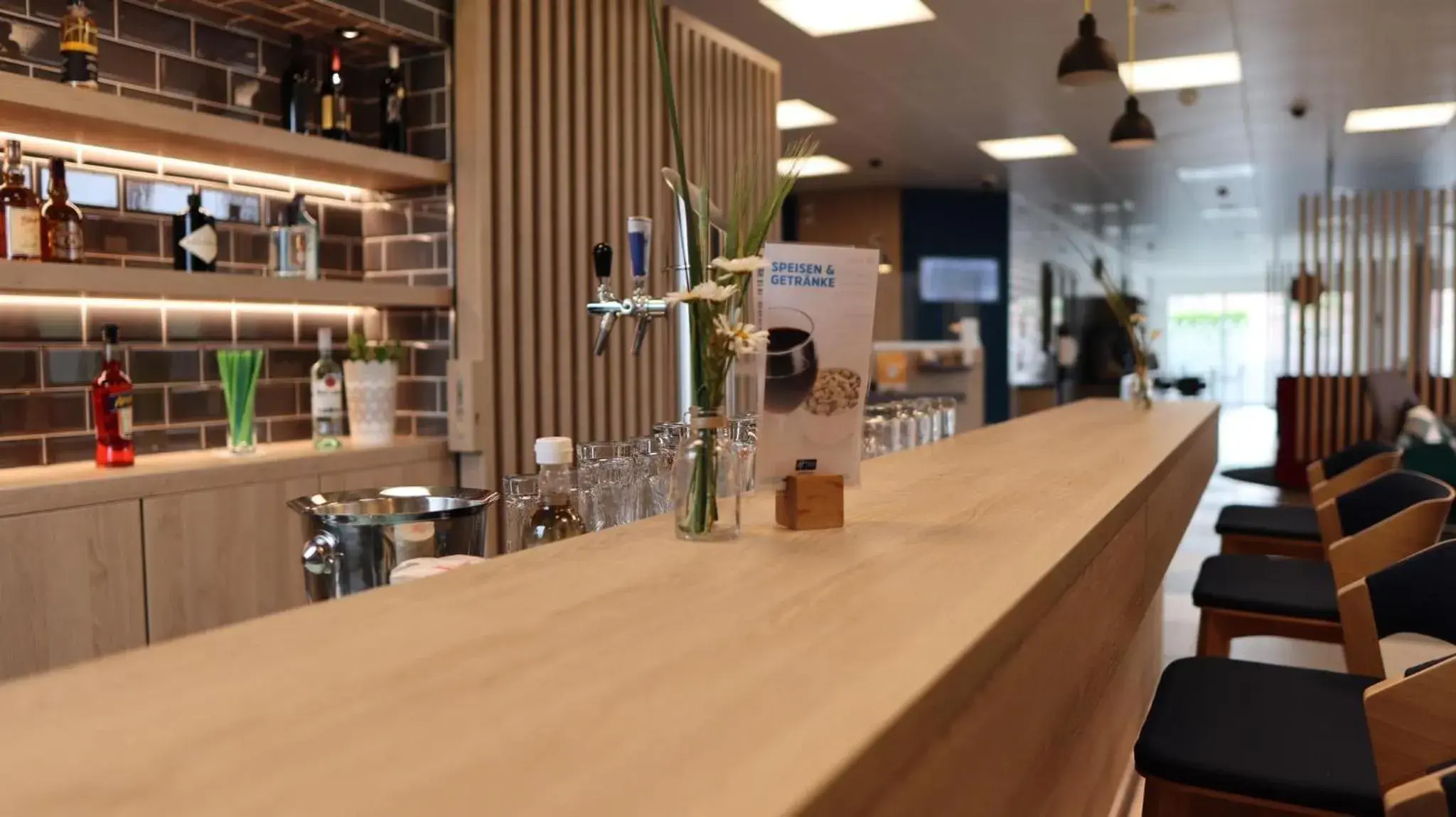 Lounge or bar in Holiday Inn Express Luzern-Neuenkirch by IHG Lounge or bar in Holiday Inn Express Luzern-Neuenkirch by IHG