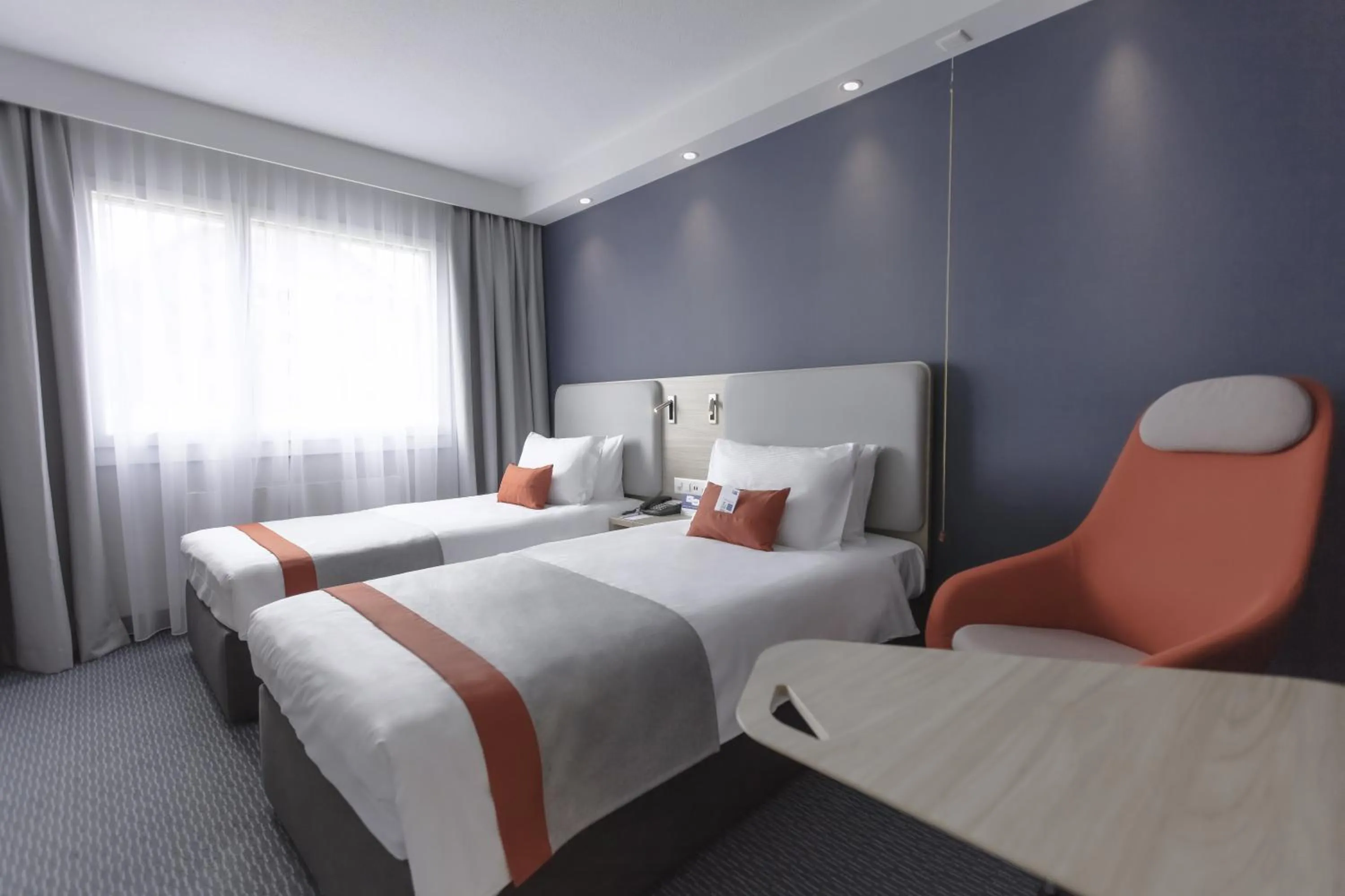 Photo of the whole room, Bed in Holiday Inn Express Luzern-Neuenkirch by IHG