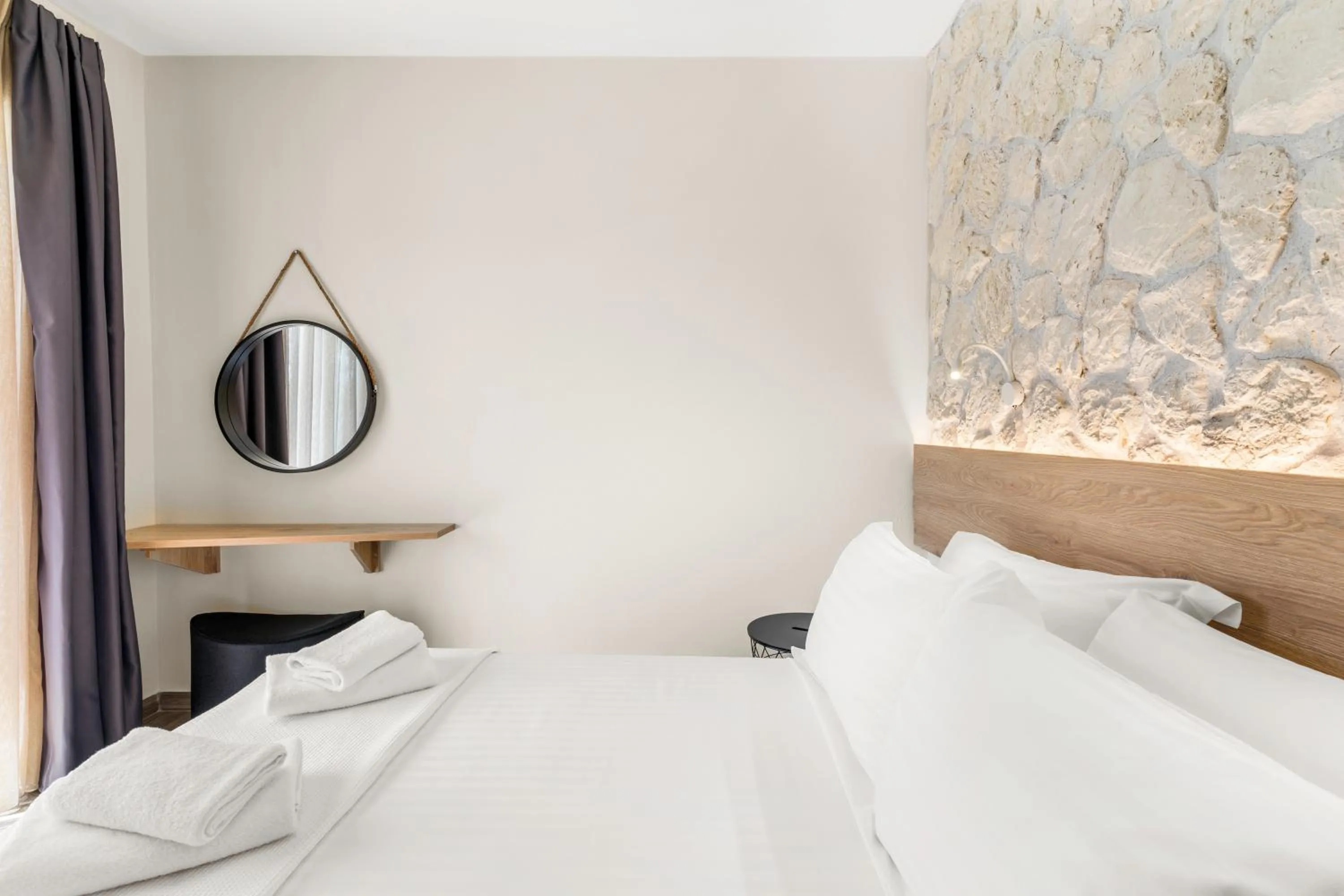 Bed in Sigma Luxury Rooms