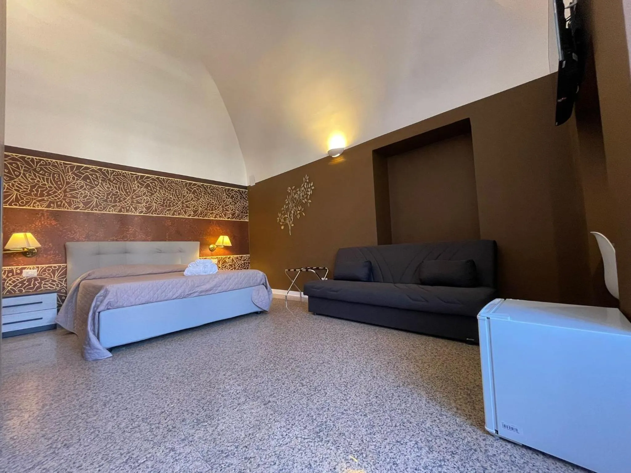 Bed in CconfortHotels Central Rooms