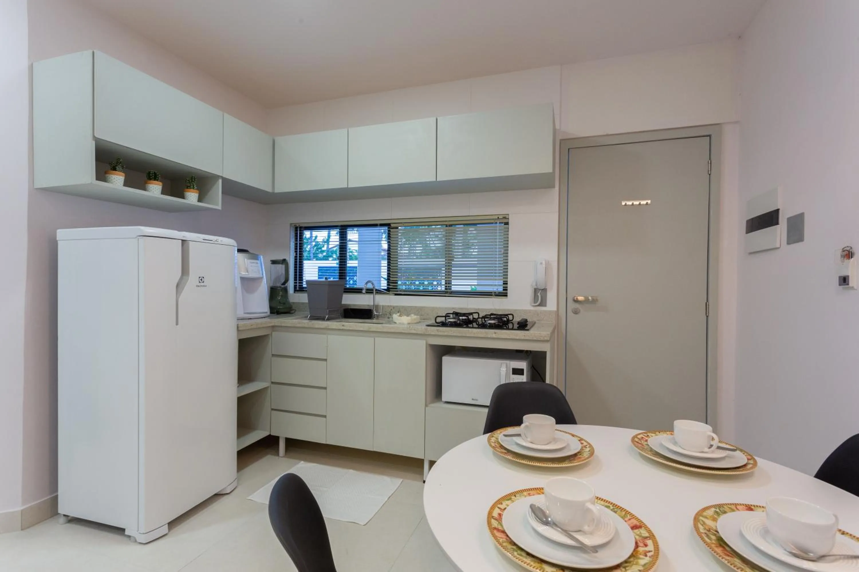 Communal kitchen in Quinta do Mar Flats Porto de Galinhas