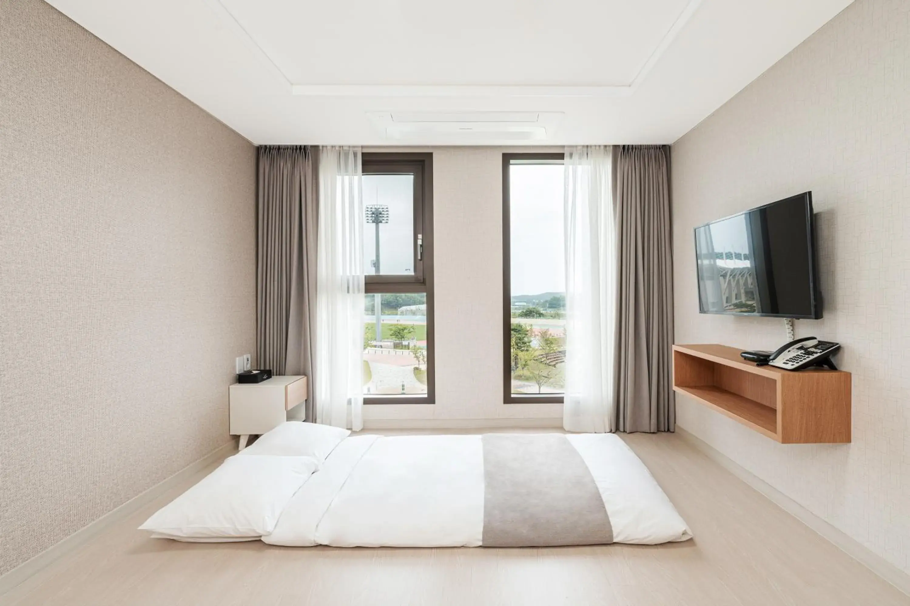 Bed in CENTUMMARK Hotel YangYang Bed in CENTUMMARK Hotel YangYang