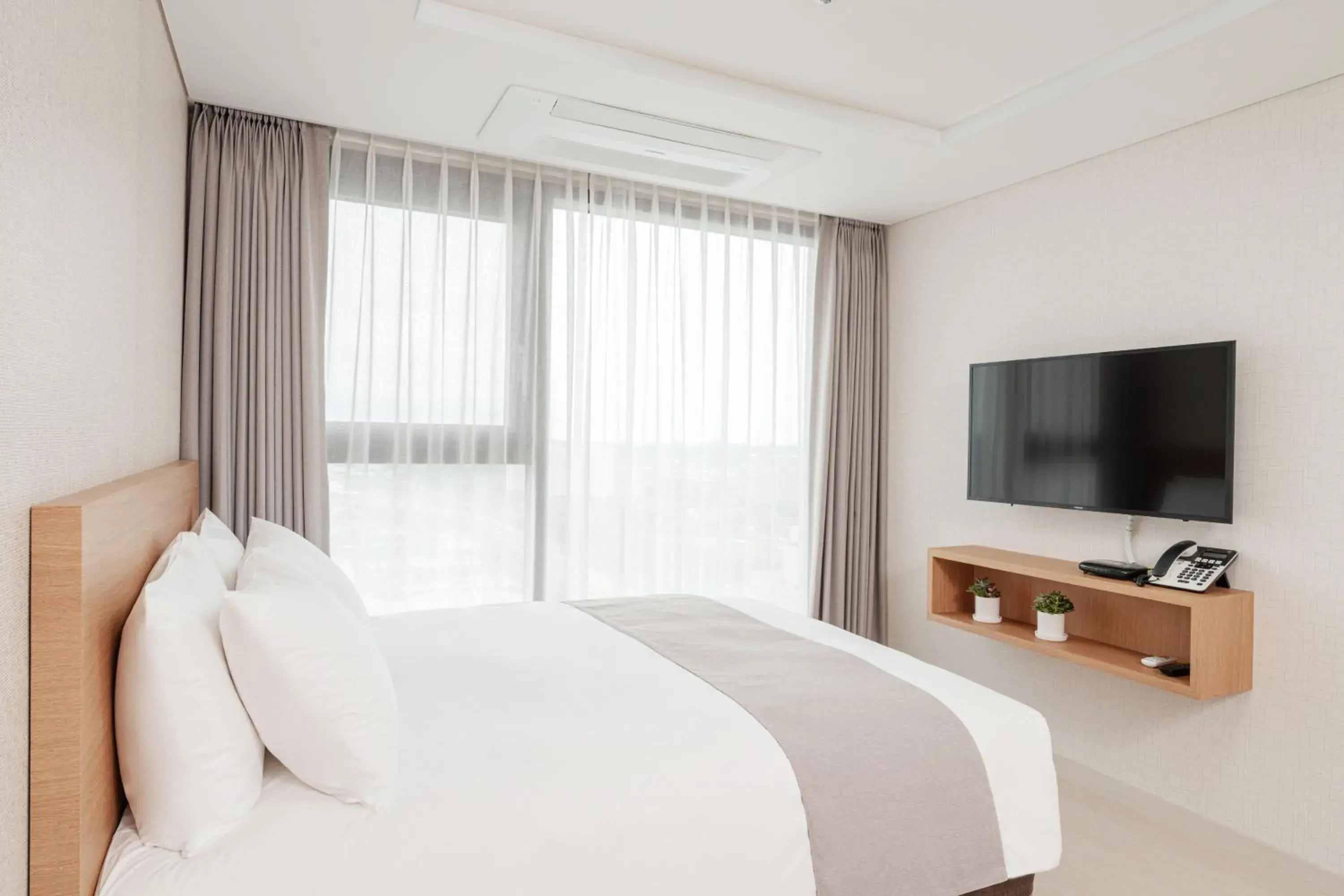 Bed in CENTUMMARK Hotel YangYang Bed in CENTUMMARK Hotel YangYang