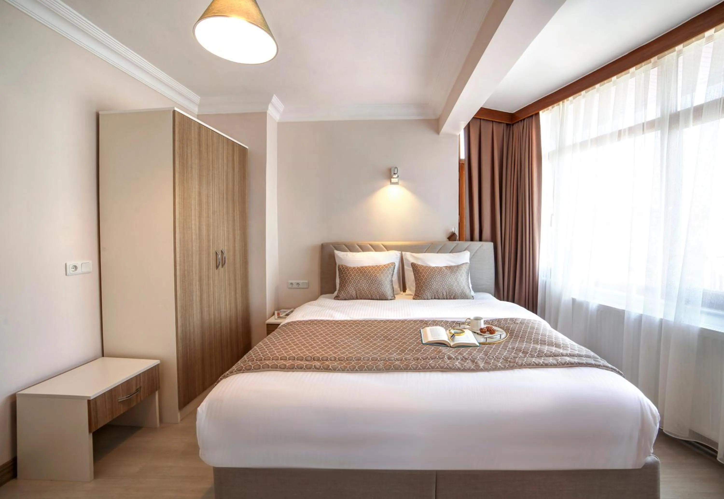 Bed in SEVEN ROSES APART HOTEL