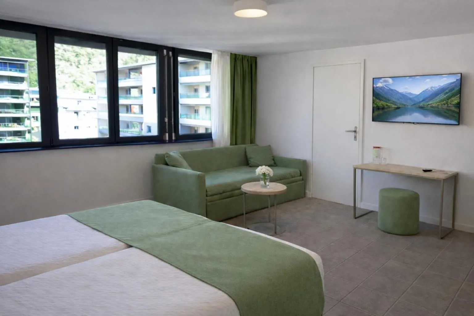 Photo of the whole room, Bed in Hotel Nessi Locarno