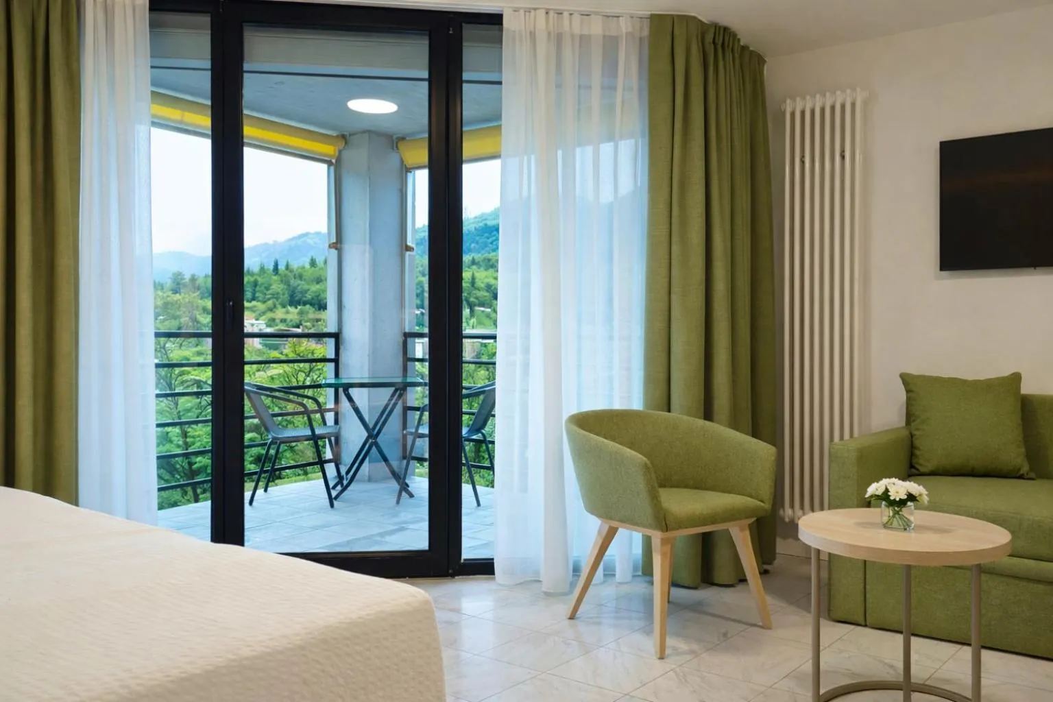 Photo of the whole room, Bed in Hotel Nessi Locarno