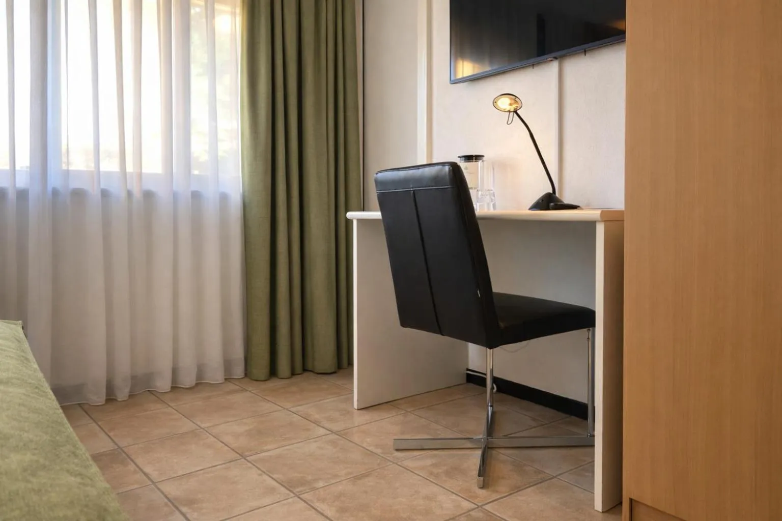 Photo of the whole room in Hotel Nessi Locarno