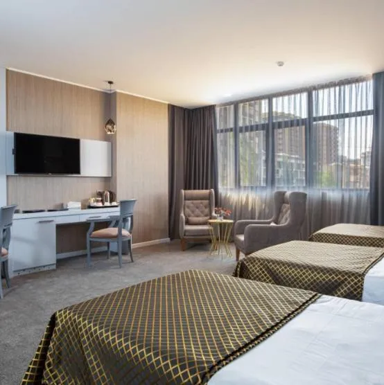 Communal lounge/ TV room, Bed in Premium Park Hotel