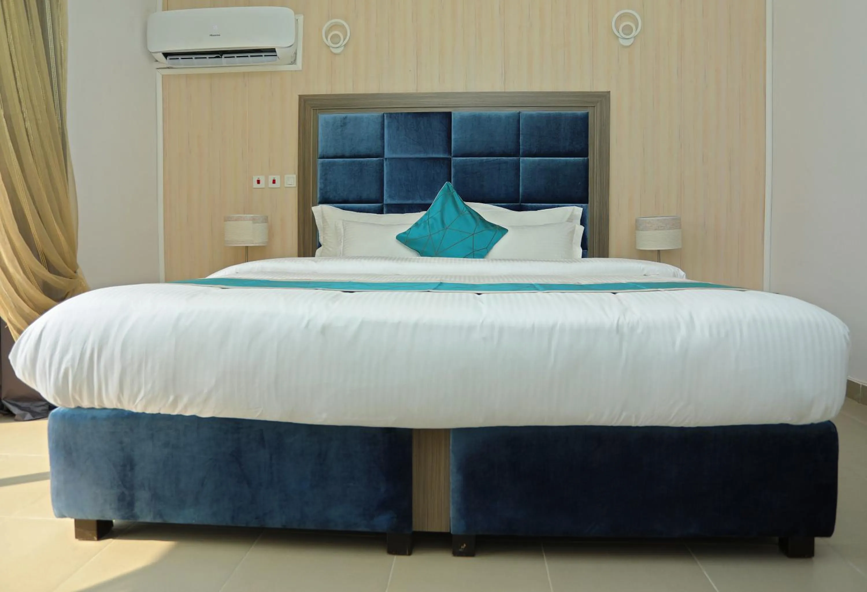 Bed in Riviera Suites