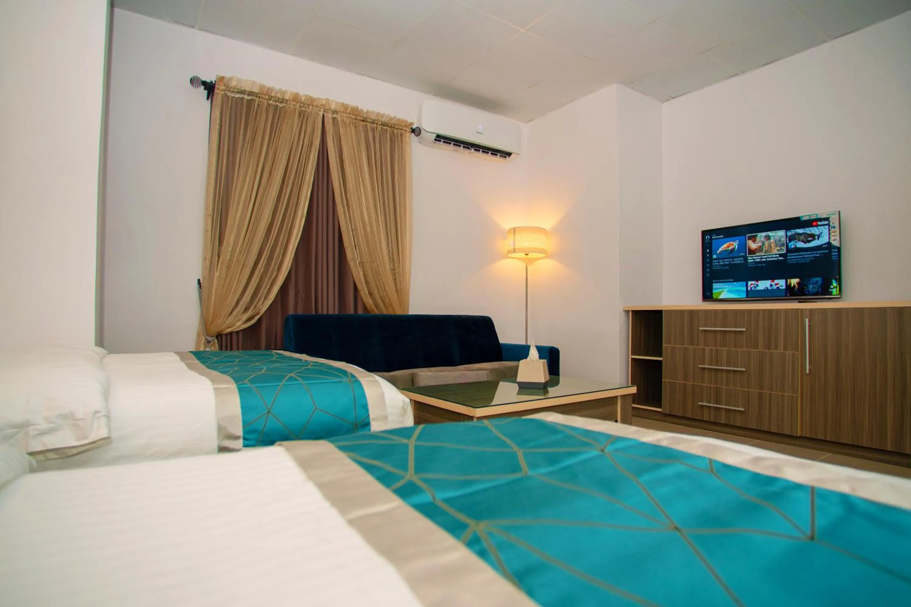 Bed in Riviera Suites