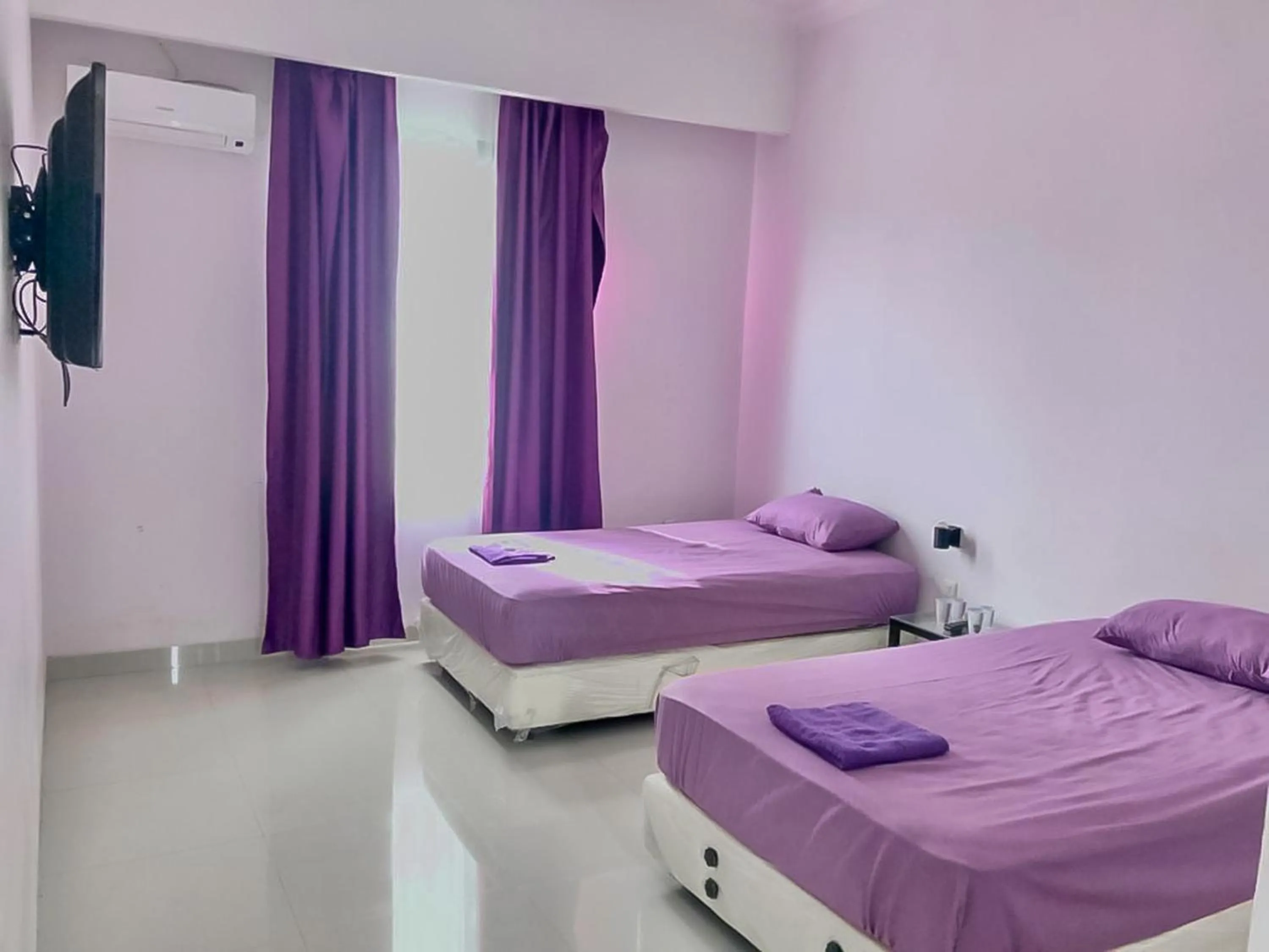 Bedroom, Bed in Tiara Guest House Samarinda RedPartner