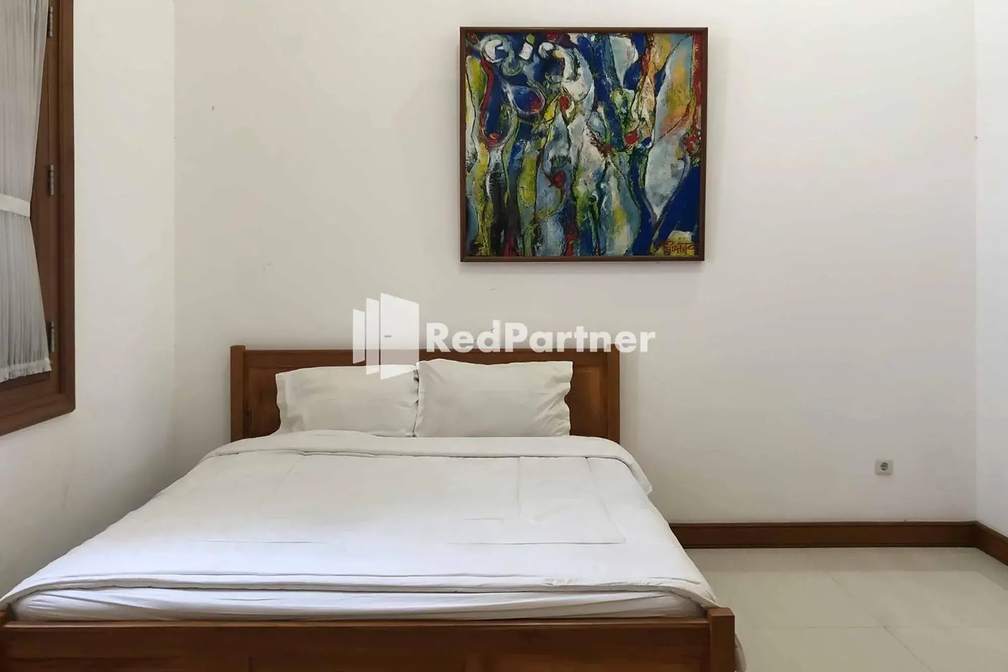 Bed in RedDoorz at Daffi Araya Bed in RedDoorz at Daffi Araya