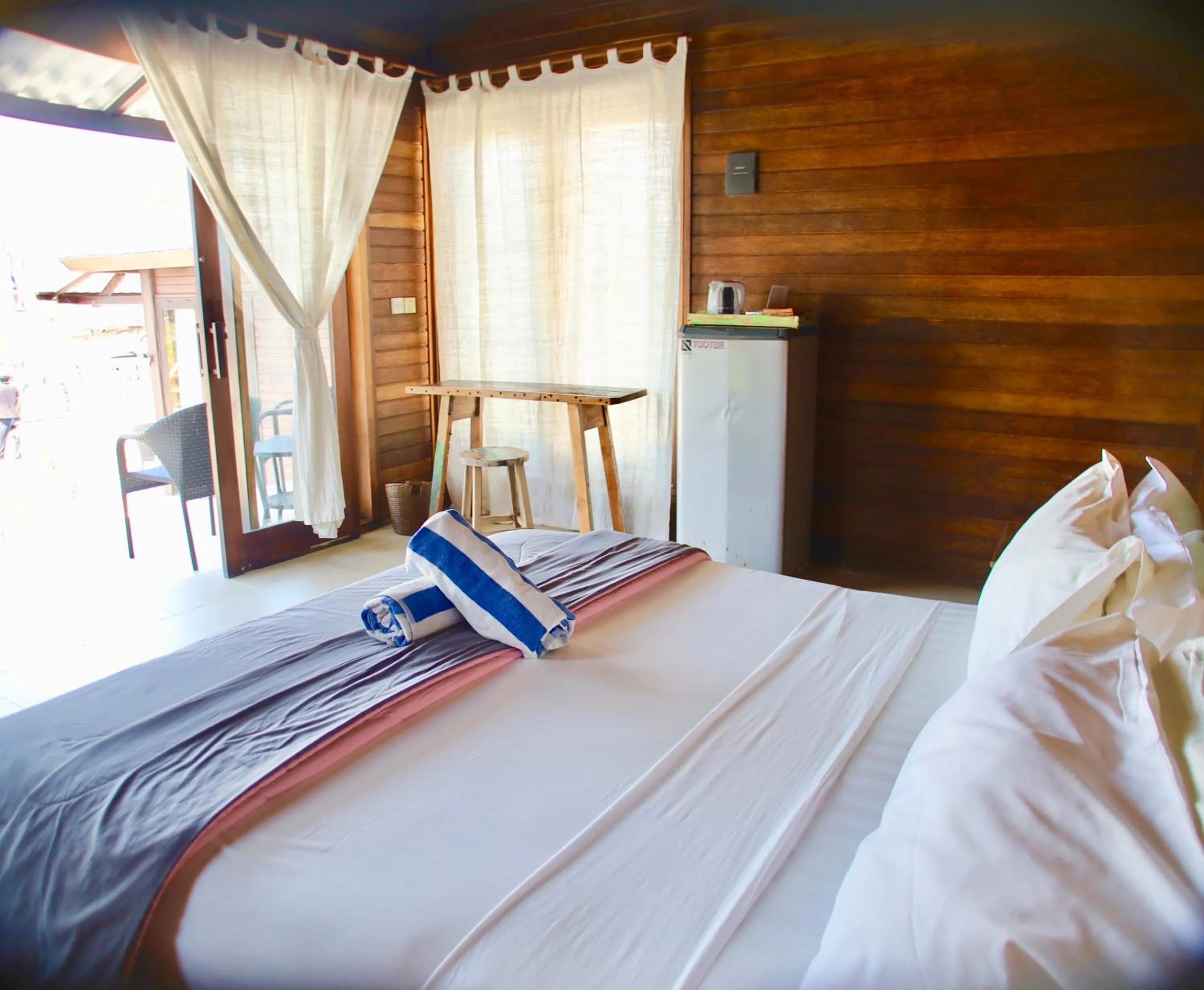 Bed in The Palms Ceningan Hotel