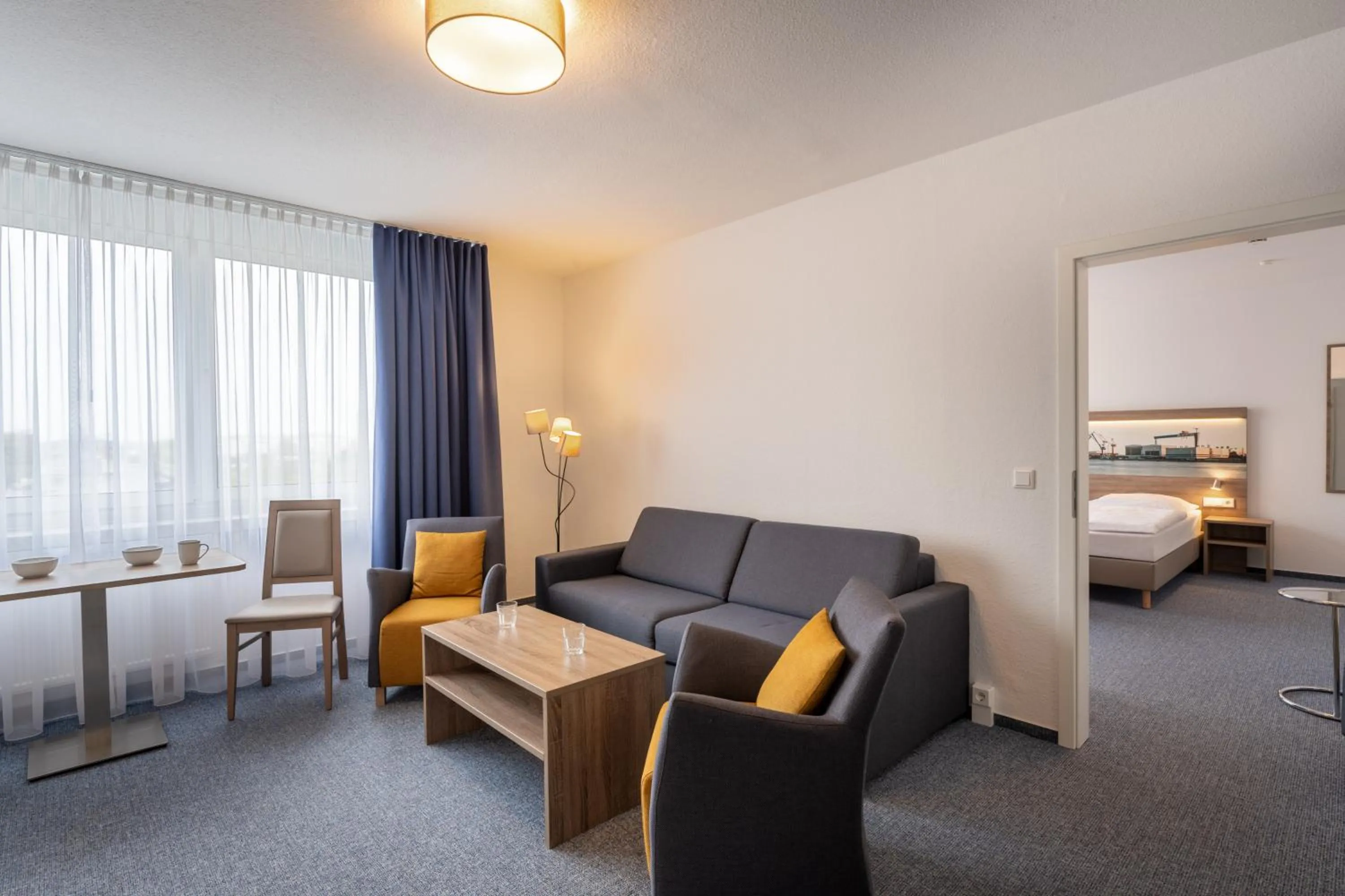 Living room, Bed in Hotel & Gästehaus Rostock Lütten Klein