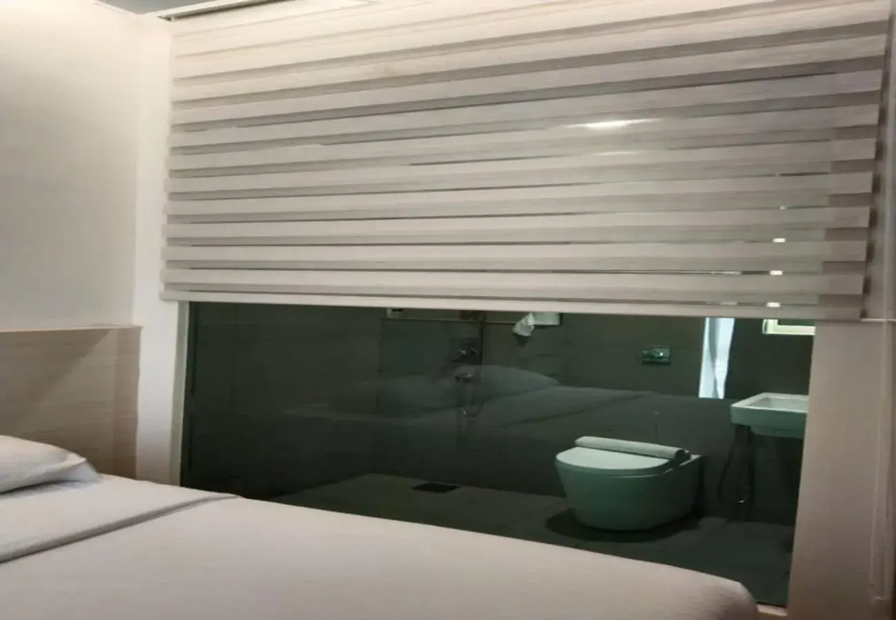 Bathroom, Bed in Minimalist Hotel Bathroom, Bed in Minimalist Hotel