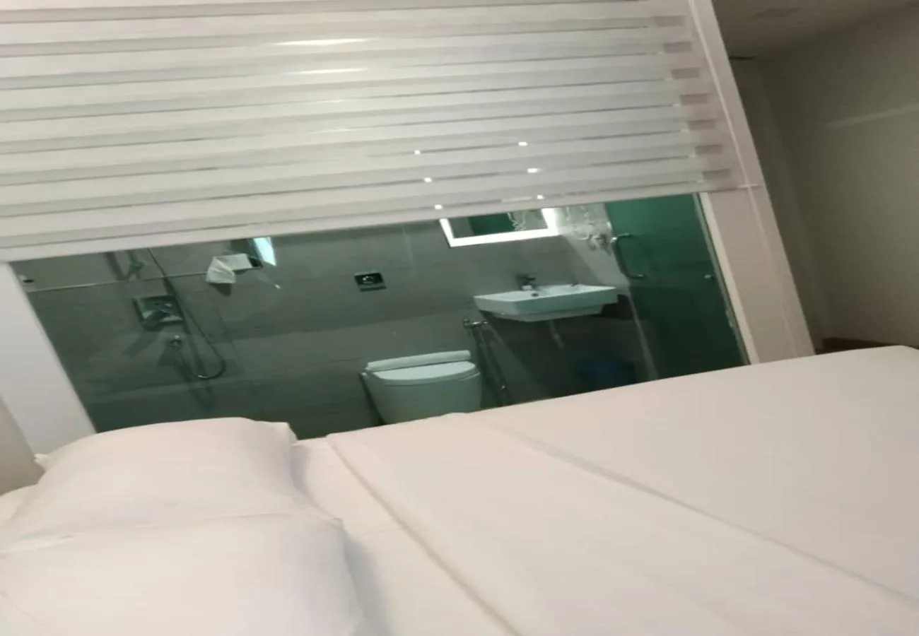 Bathroom, Bed in Minimalist Hotel