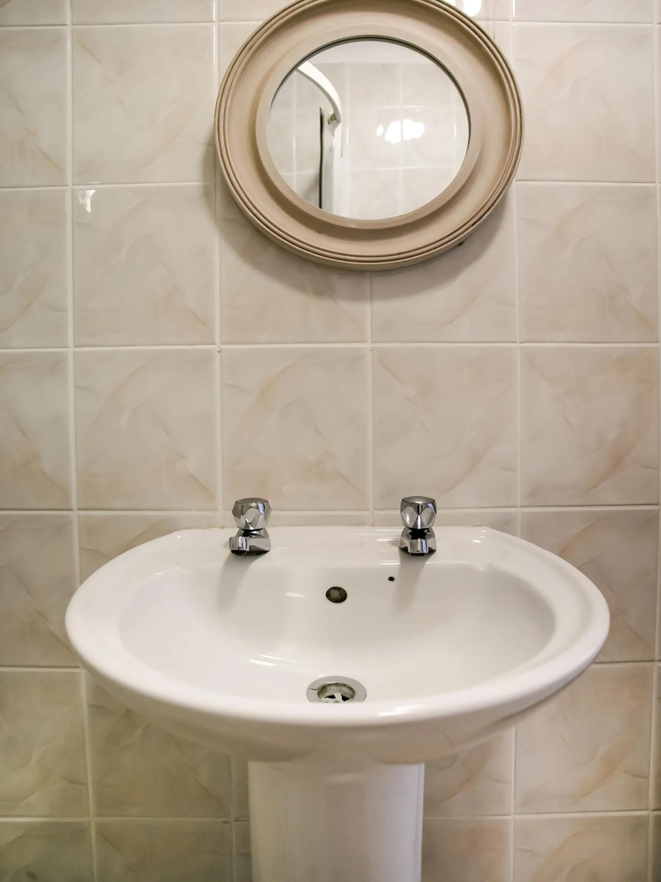 Bathroom in OYO Gin House Hotel