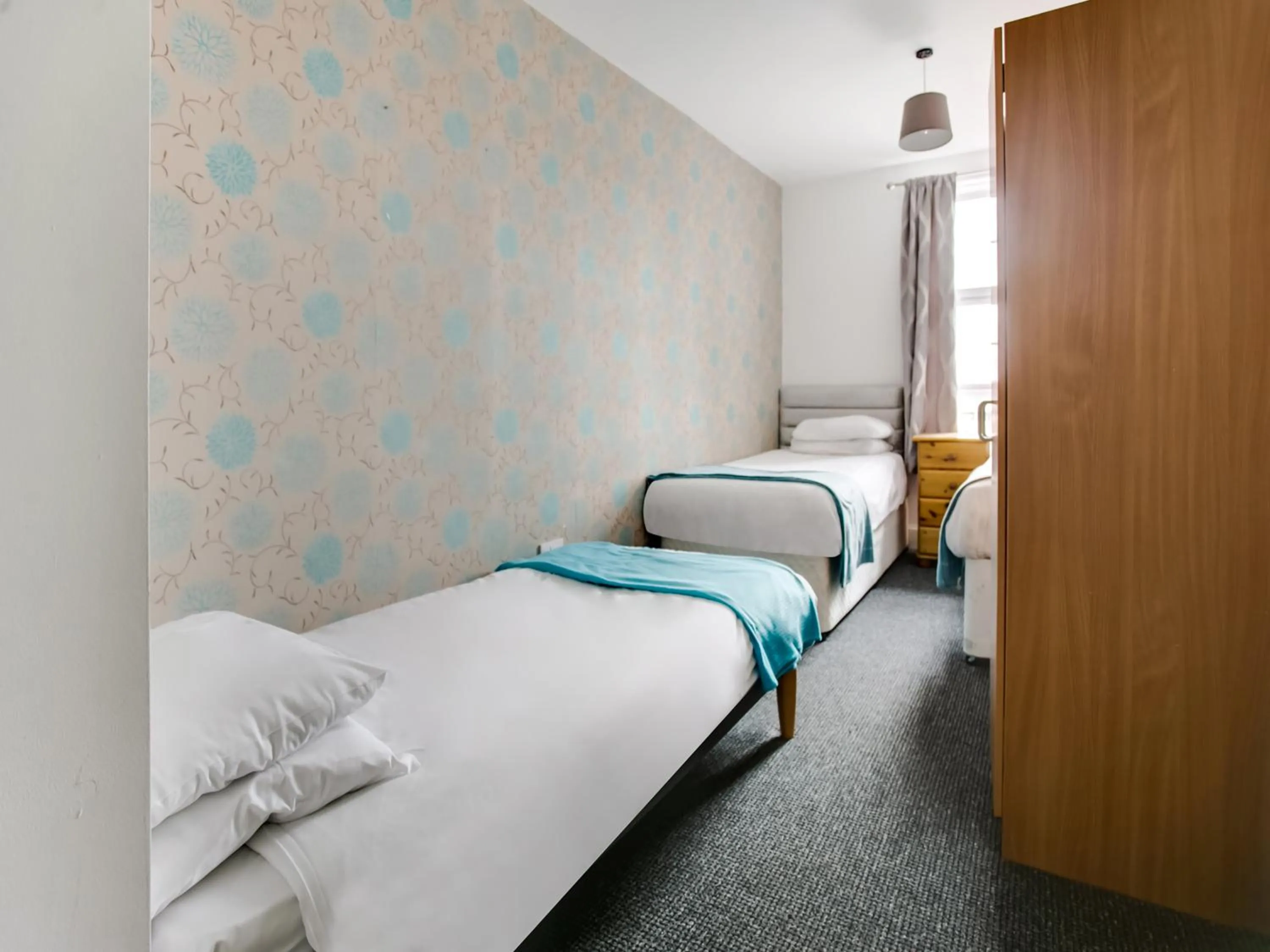 Bed in OYO Gin House Hotel