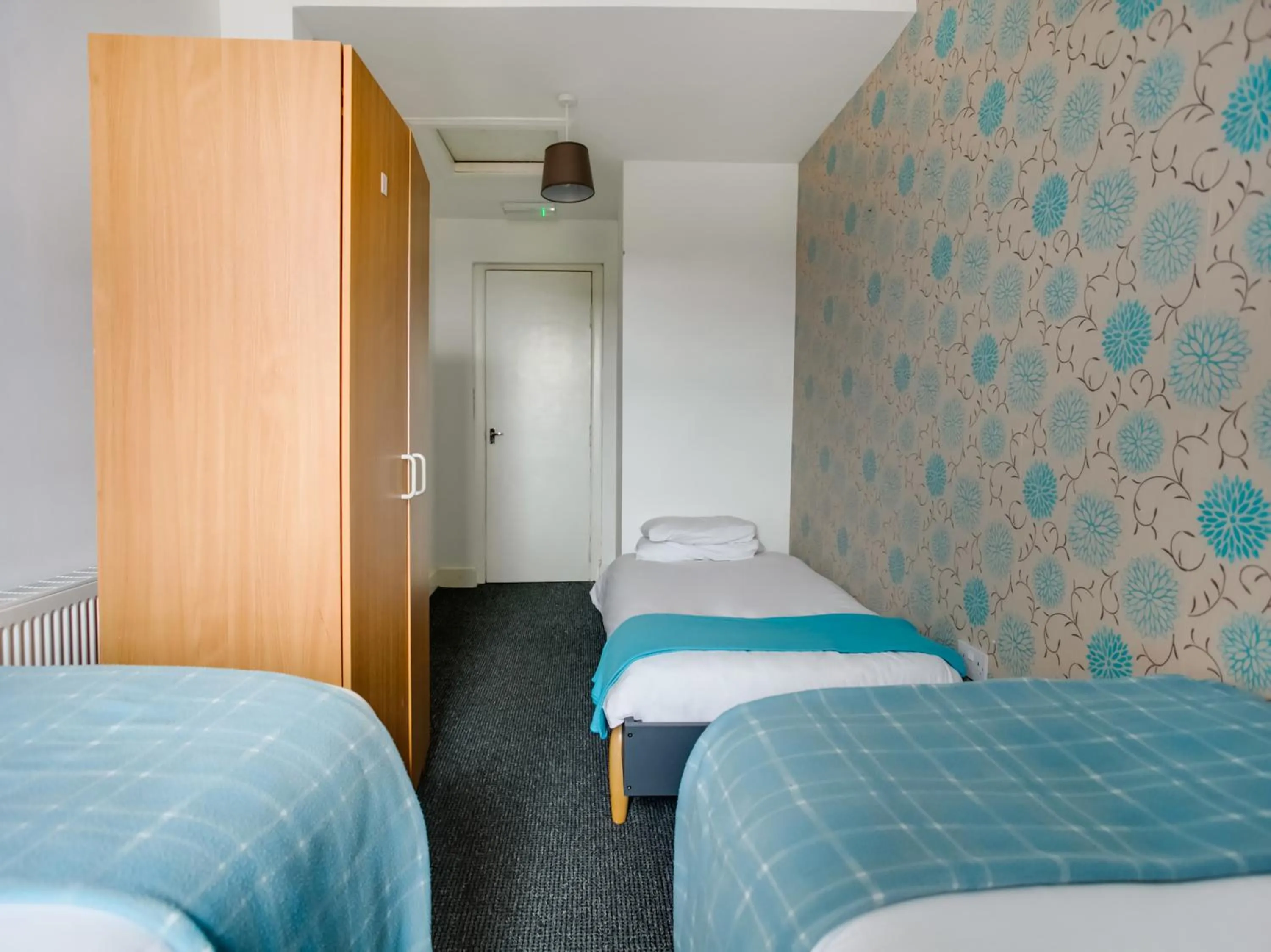 Bed in OYO Gin House Hotel