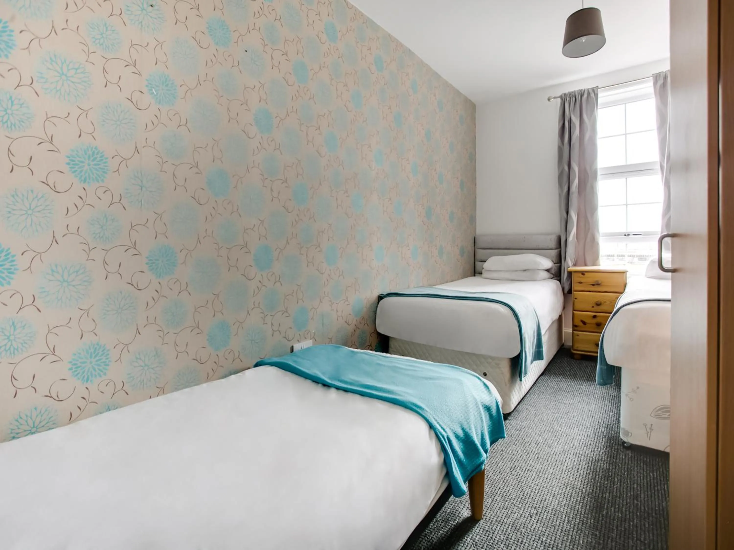 Bed in OYO Gin House Hotel