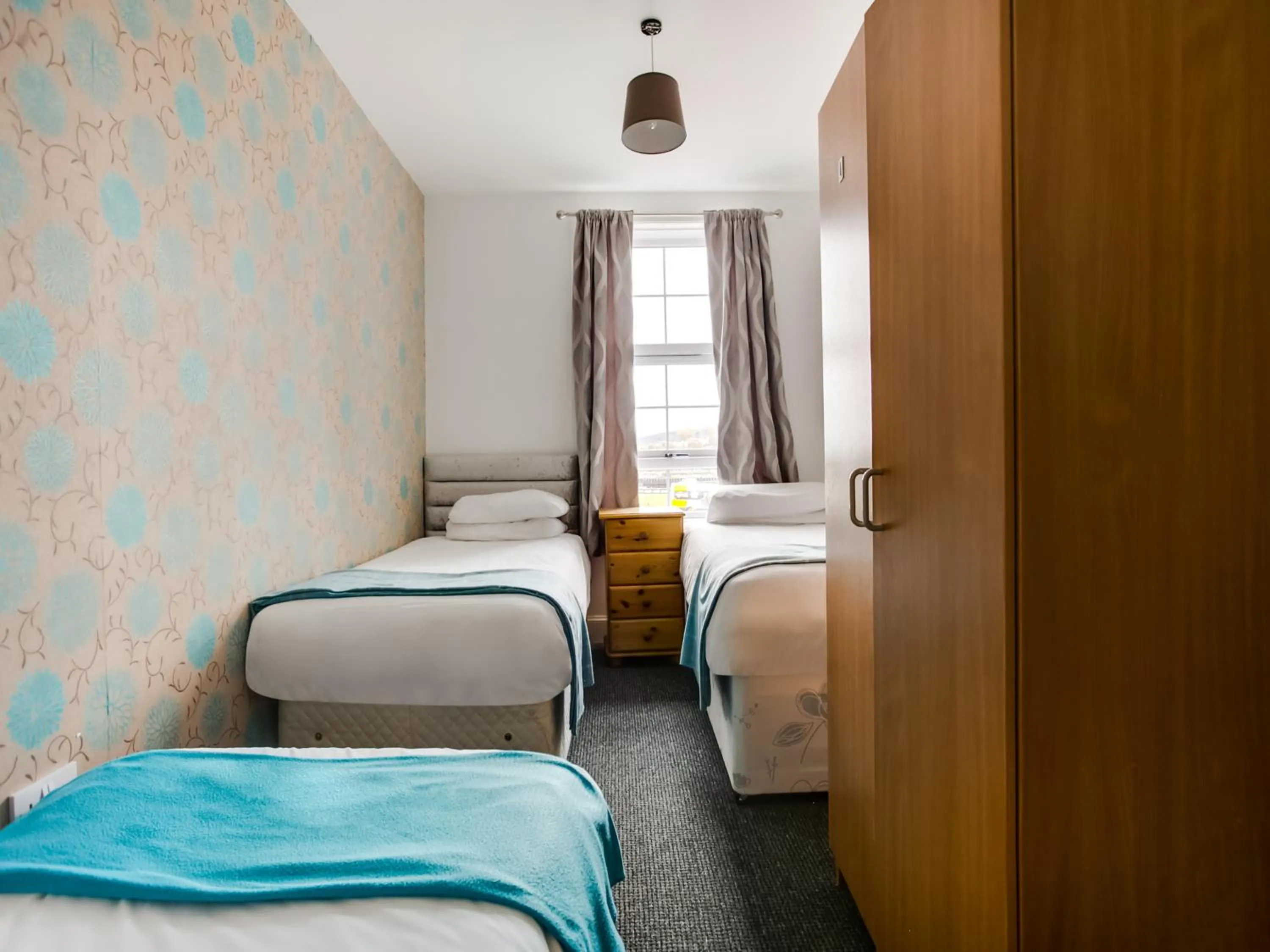 Bed in OYO Gin House Hotel