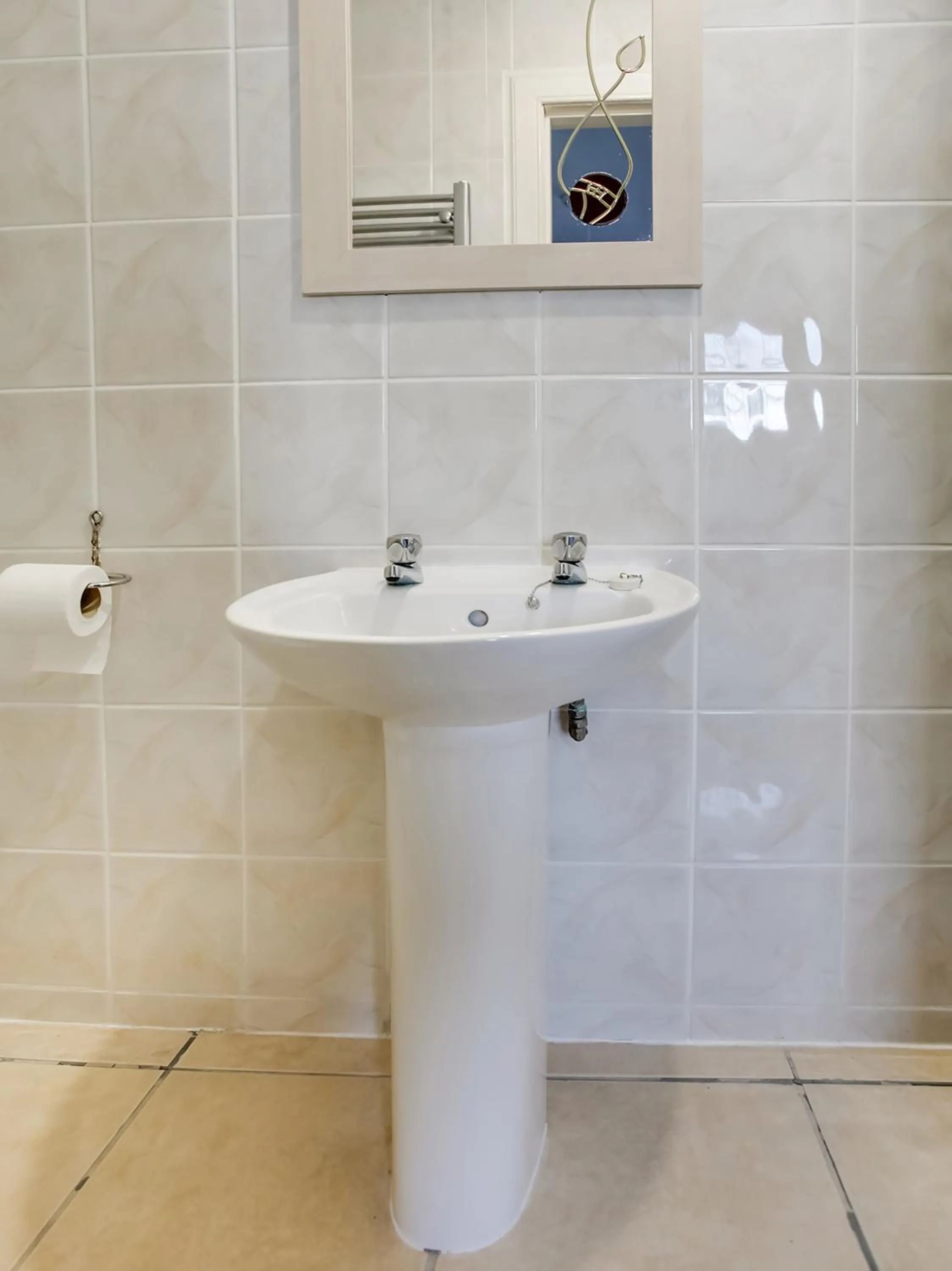 Bathroom in OYO Gin House Hotel