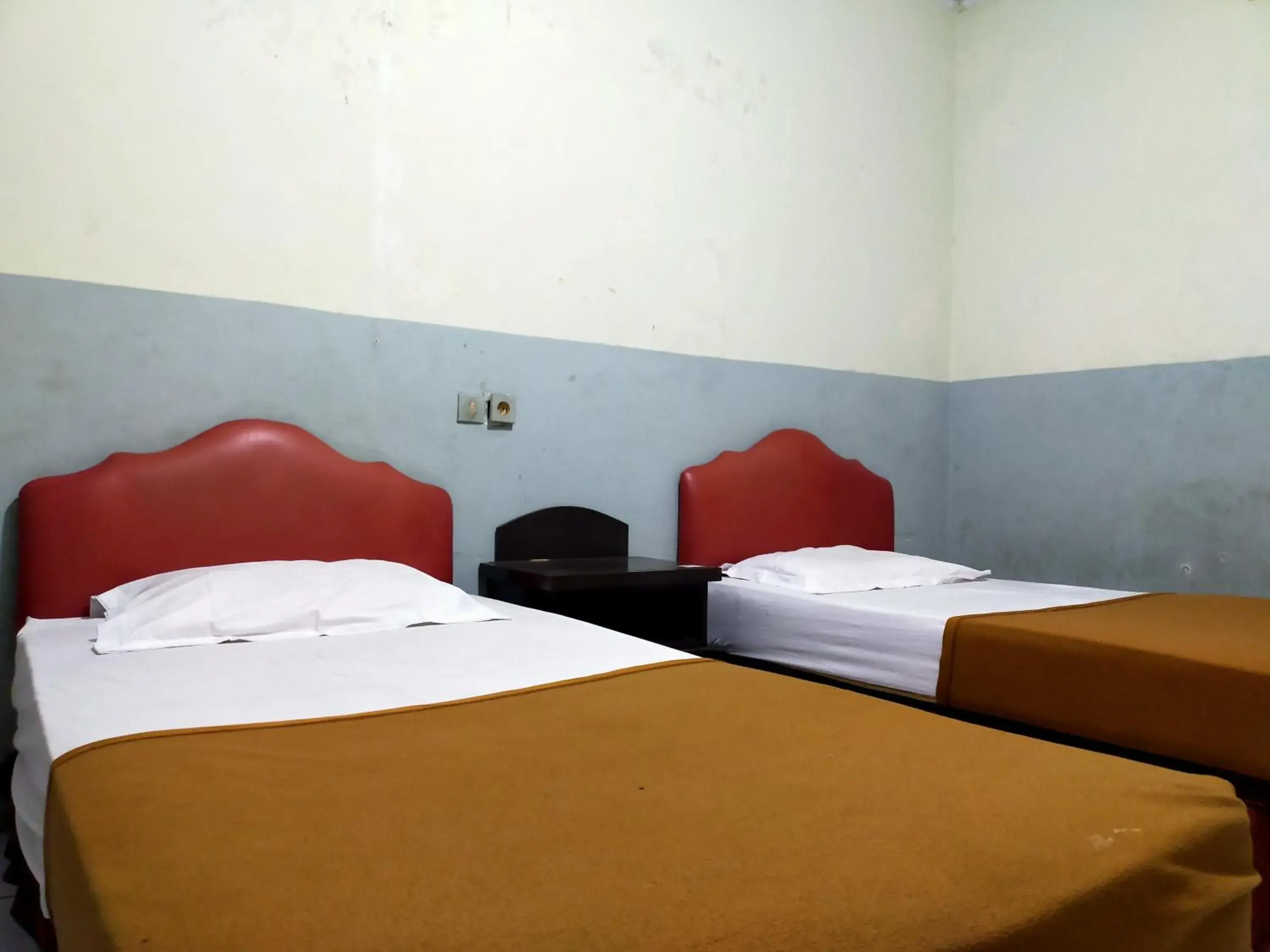 Bed in Hotel Nirwana Ternate RedPartner Bed in Hotel Nirwana Ternate RedPartner