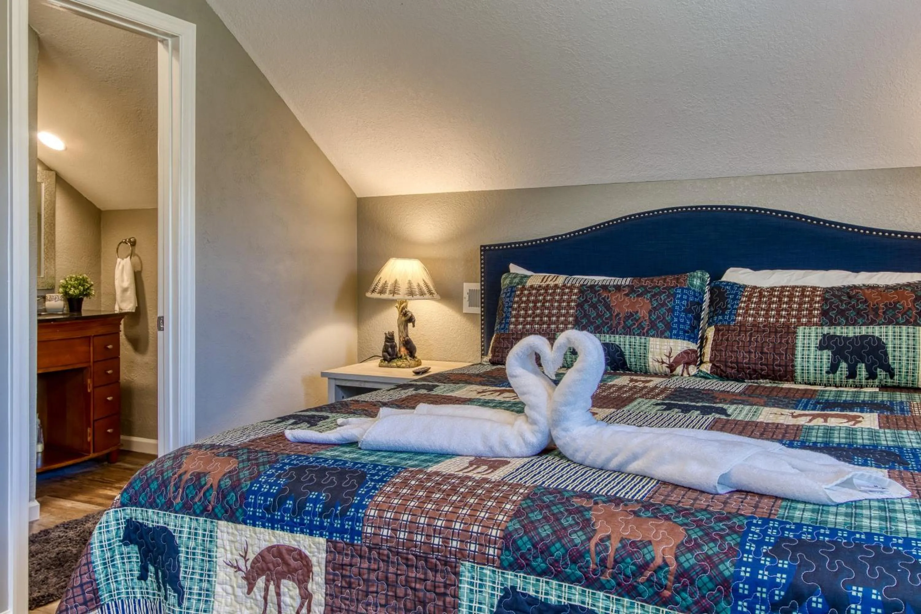 Bed in Rustic River Lodge by HoneyBearCabins 7BR 6BA sleeps 21