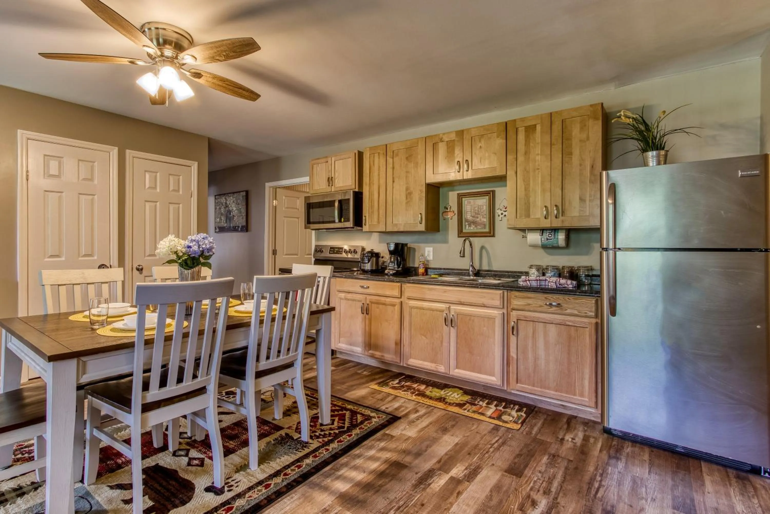 Kitchen or kitchenette in Rustic River Lodge by HoneyBearCabins 7BR 6BA sleeps 21
