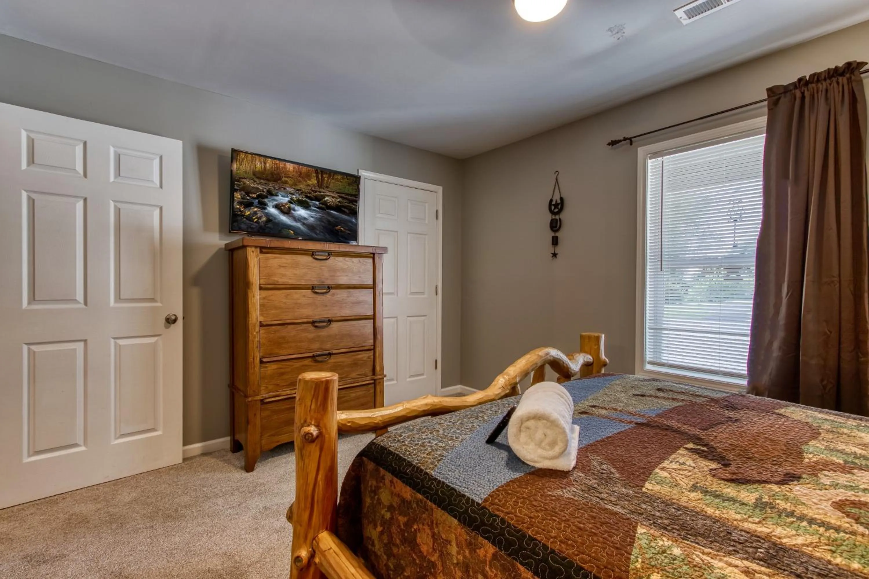 Bed in Rustic River Lodge by HoneyBearCabins 7BR 6BA sleeps 21