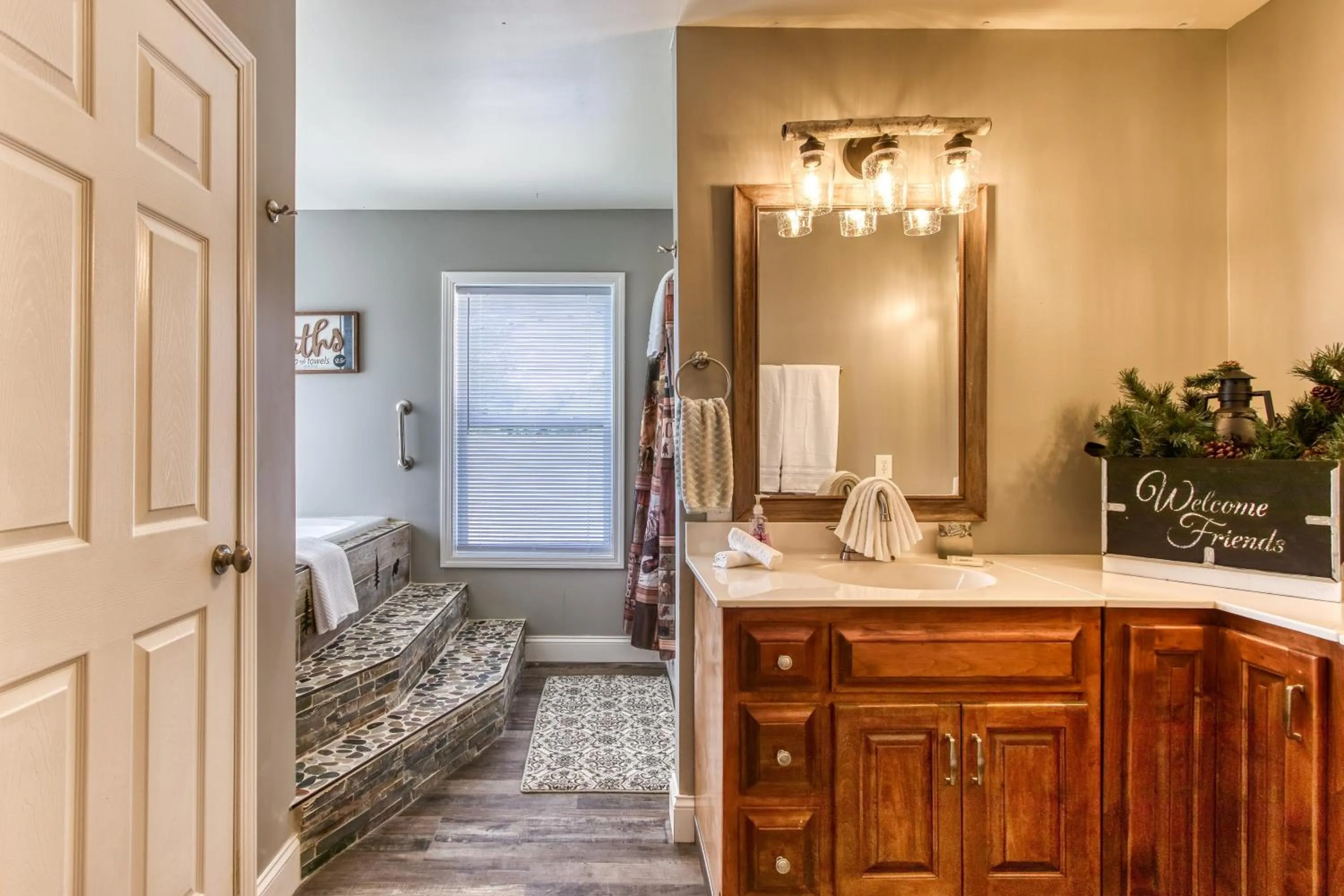 Bathroom in Rustic River Lodge by HoneyBearCabins 7BR 6BA sleeps 21