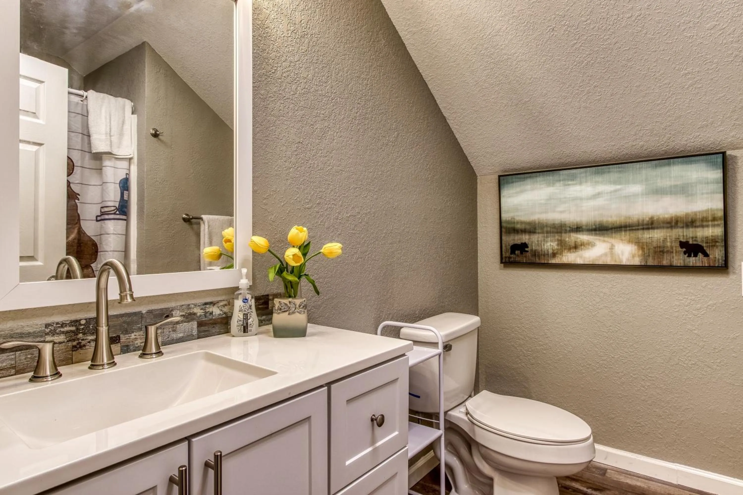 Toilet in Rustic River Lodge by HoneyBearCabins 7BR 6BA sleeps 21