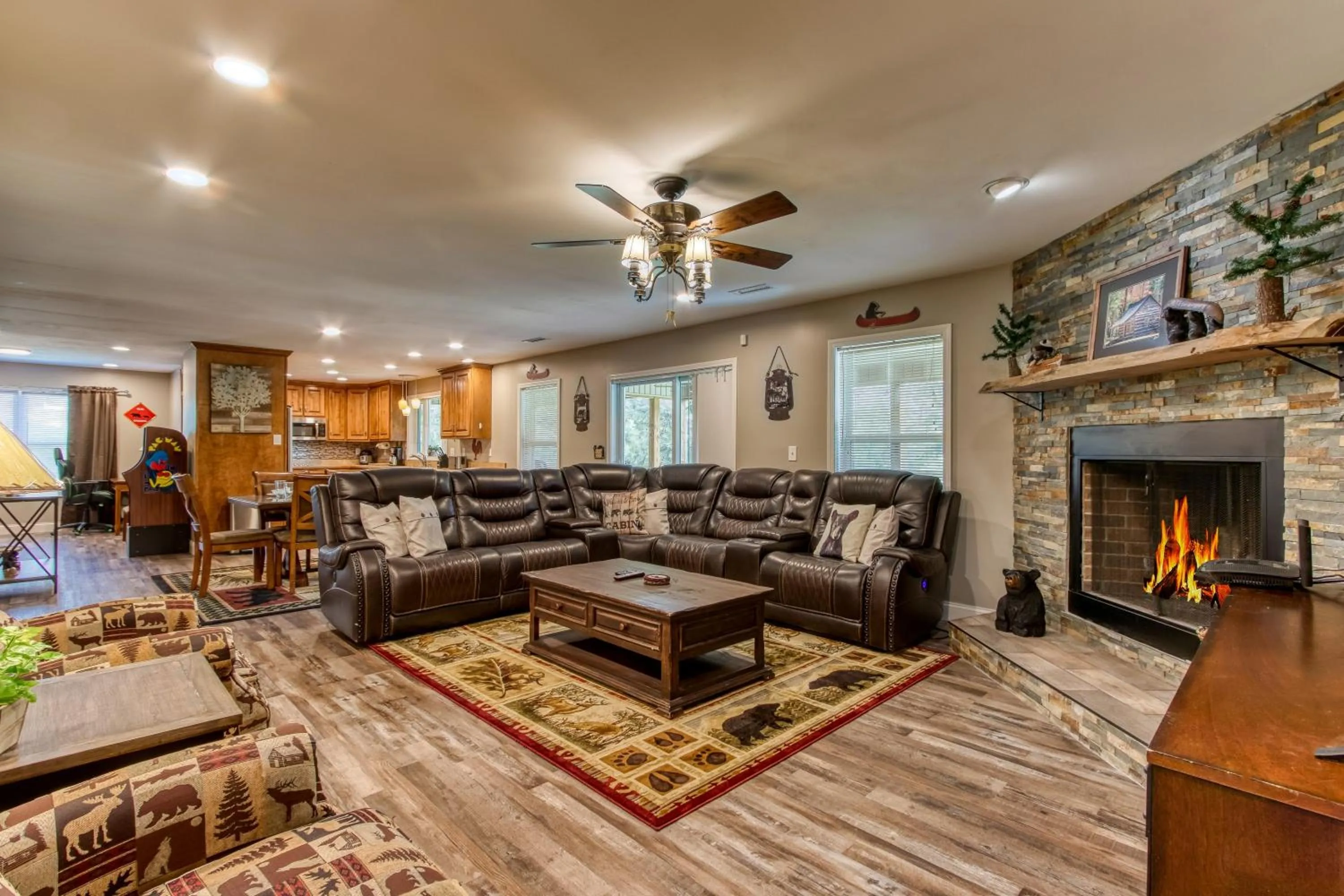 Living room in Rustic River Lodge by HoneyBearCabins 7BR 6BA sleeps 21