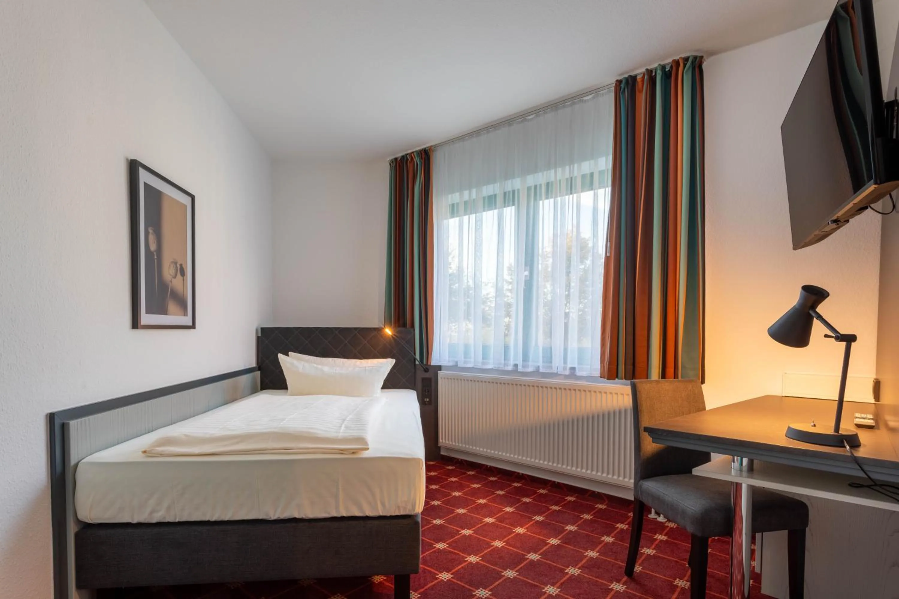 Photo of the whole room, Bed in Montana Trend Hotel Lehrte