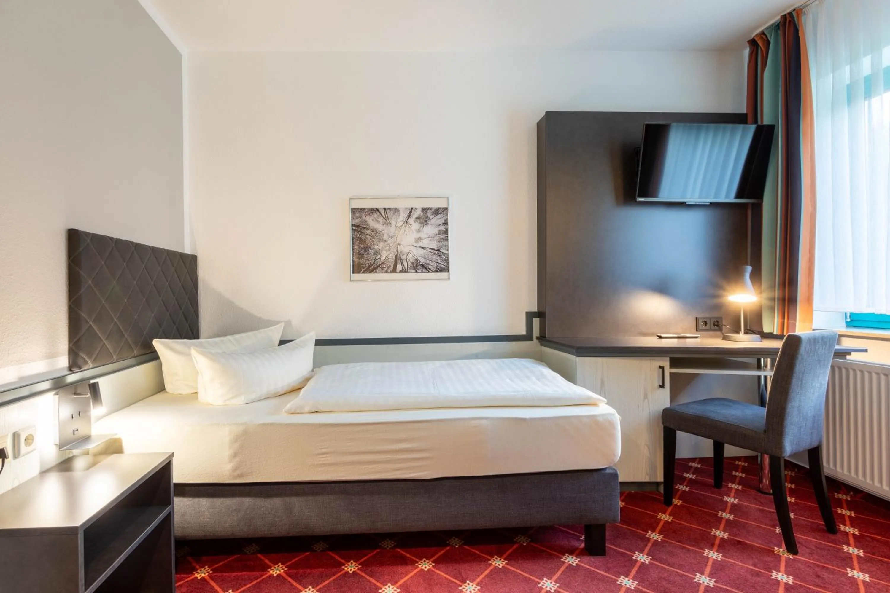 Bed in Montana Trend Hotel Lehrte