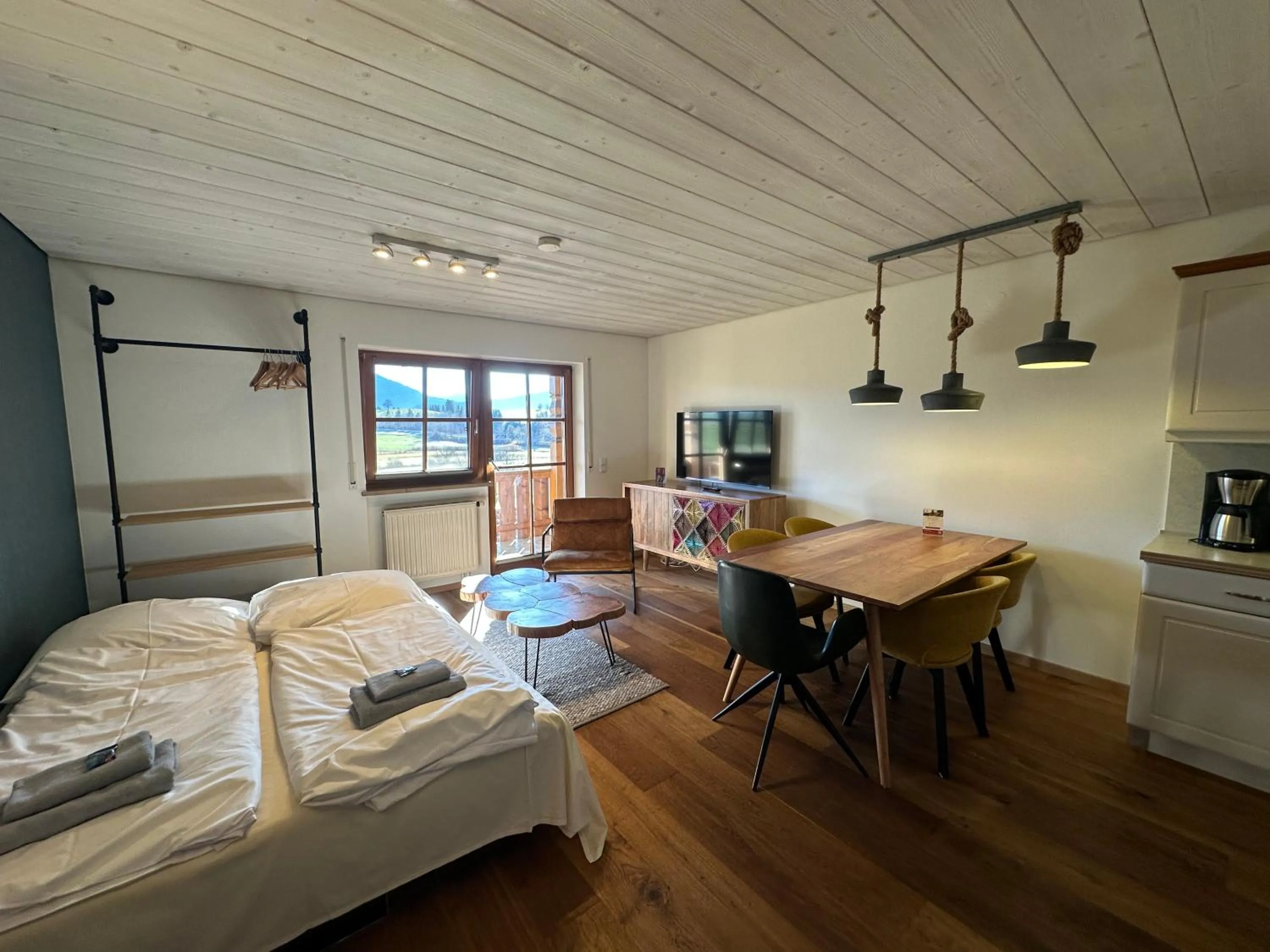 Living room, Bed in Landhaus Kössel