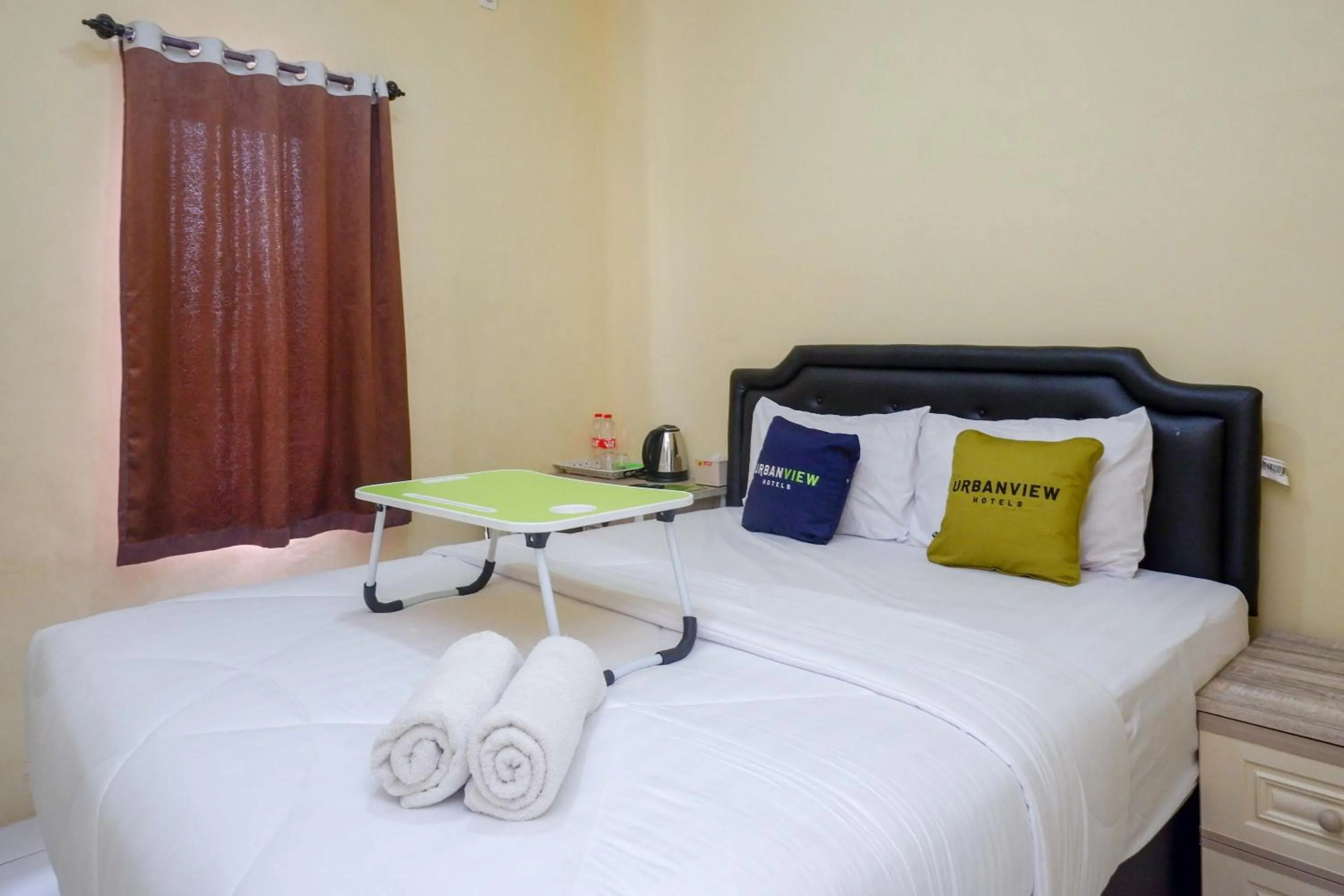 Bedroom, Bed in Urbanview Hotel Jogja City Mall