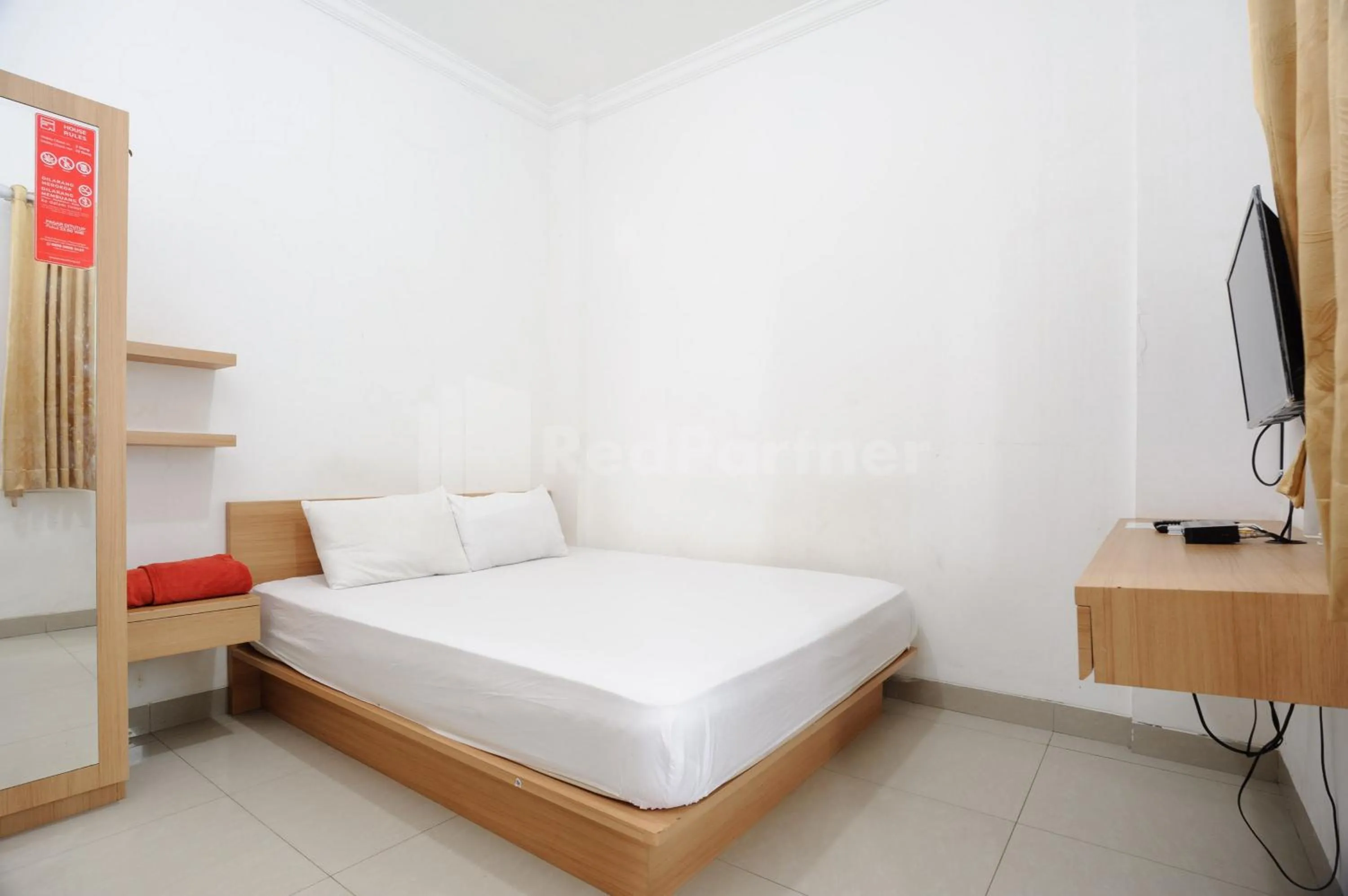 Bed in Family Residence Mitra RedDoorz