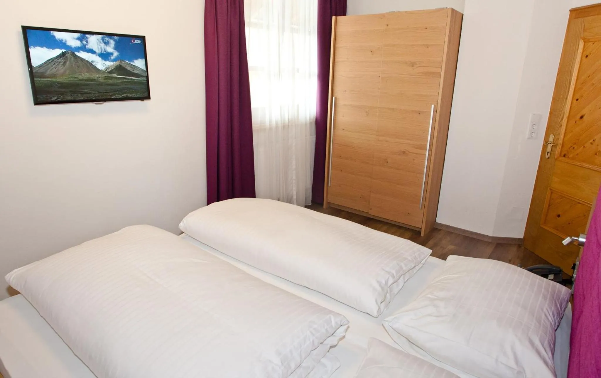 Bed in Hotel Gasthof Mitteregger - BEST PLACE in town with summercard included