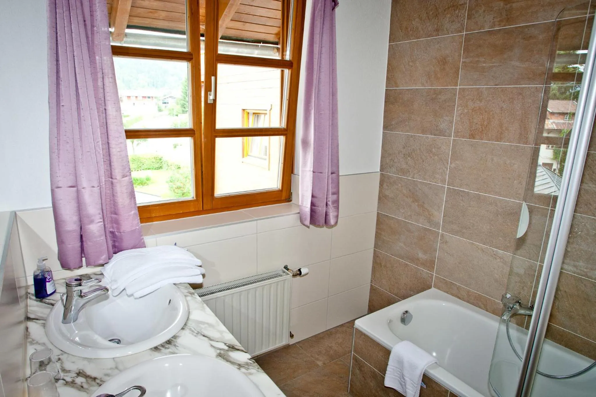 Bathroom in Hotel Gasthof Mitteregger - BEST PLACE in town with summercard included