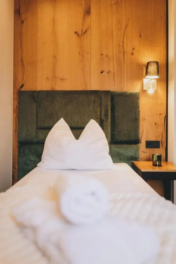 Bed in Hotel Gasthof Mitteregger - BEST PLACE in town with summercard included