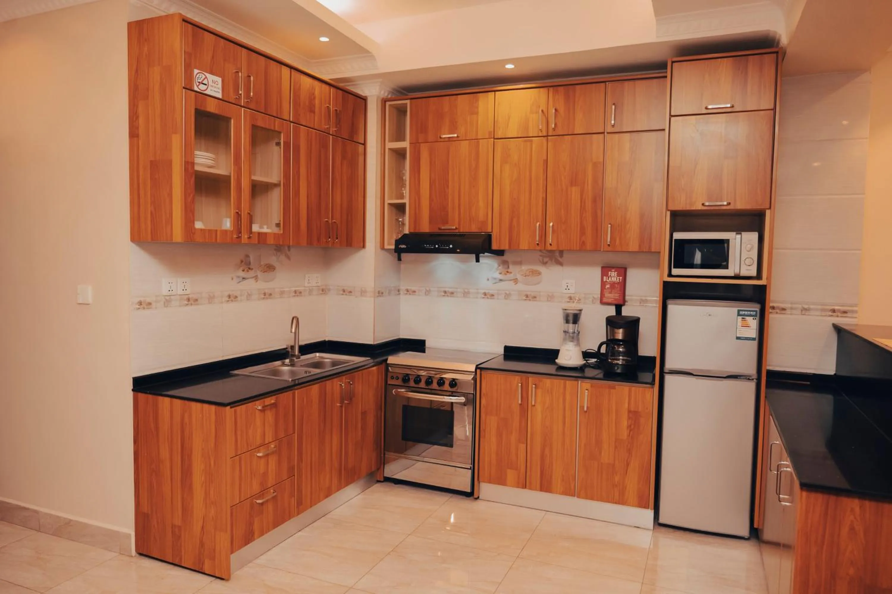 Kitchen or kitchenette in Madras Hotel and Apartments