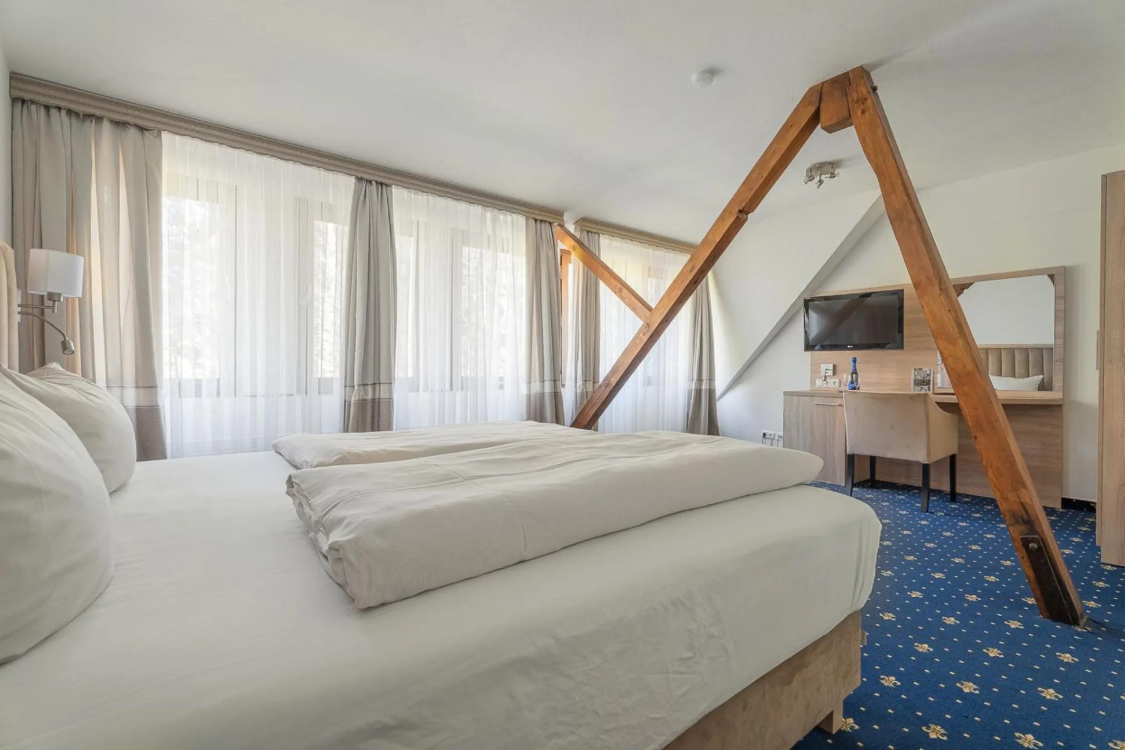 Photo of the whole room, Bed in Hotel Zur Heidschnucke - Spa & Nature Resort