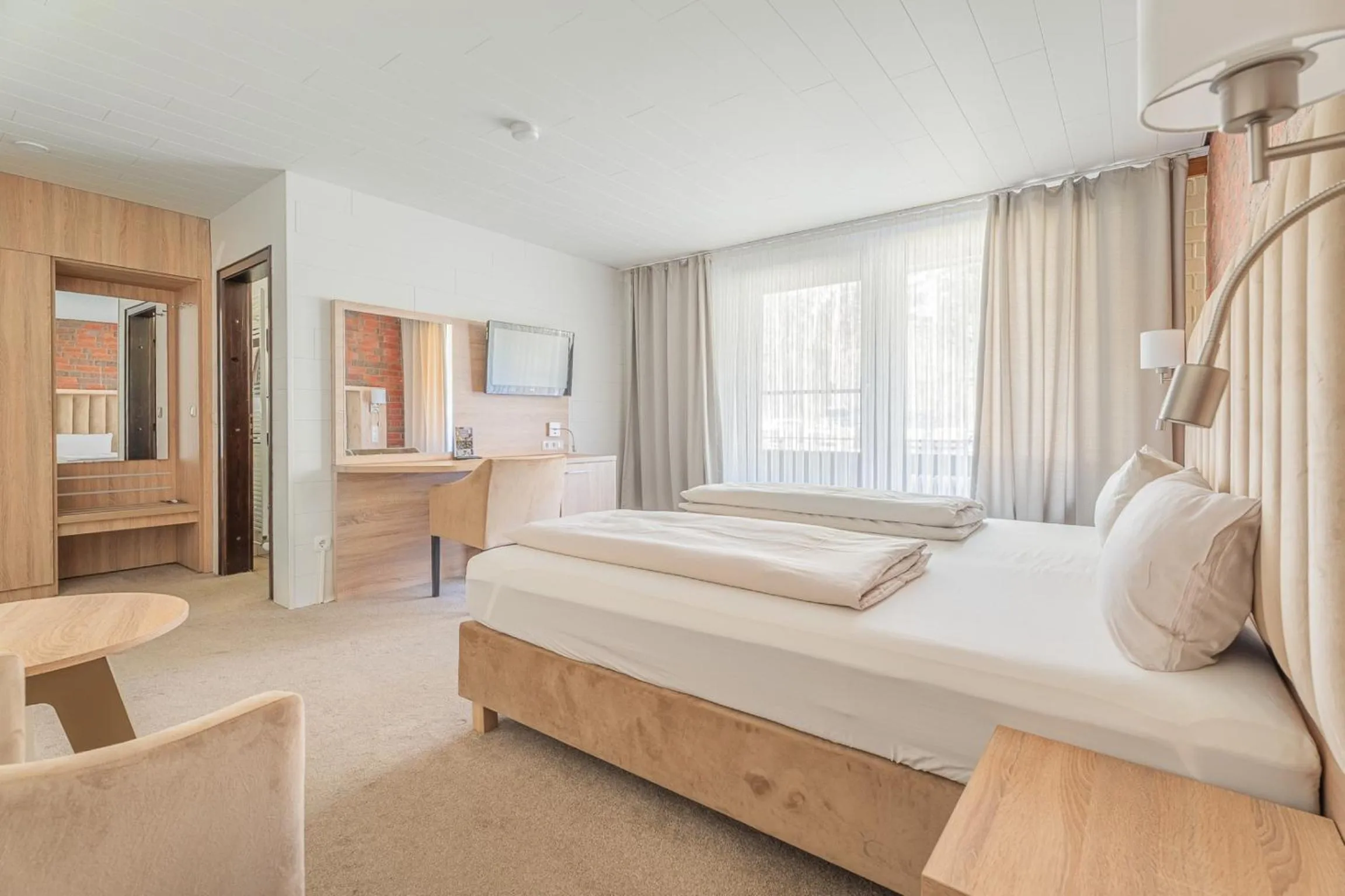 Bedroom, Bed in Hotel Zur Heidschnucke - Spa & Nature Resort