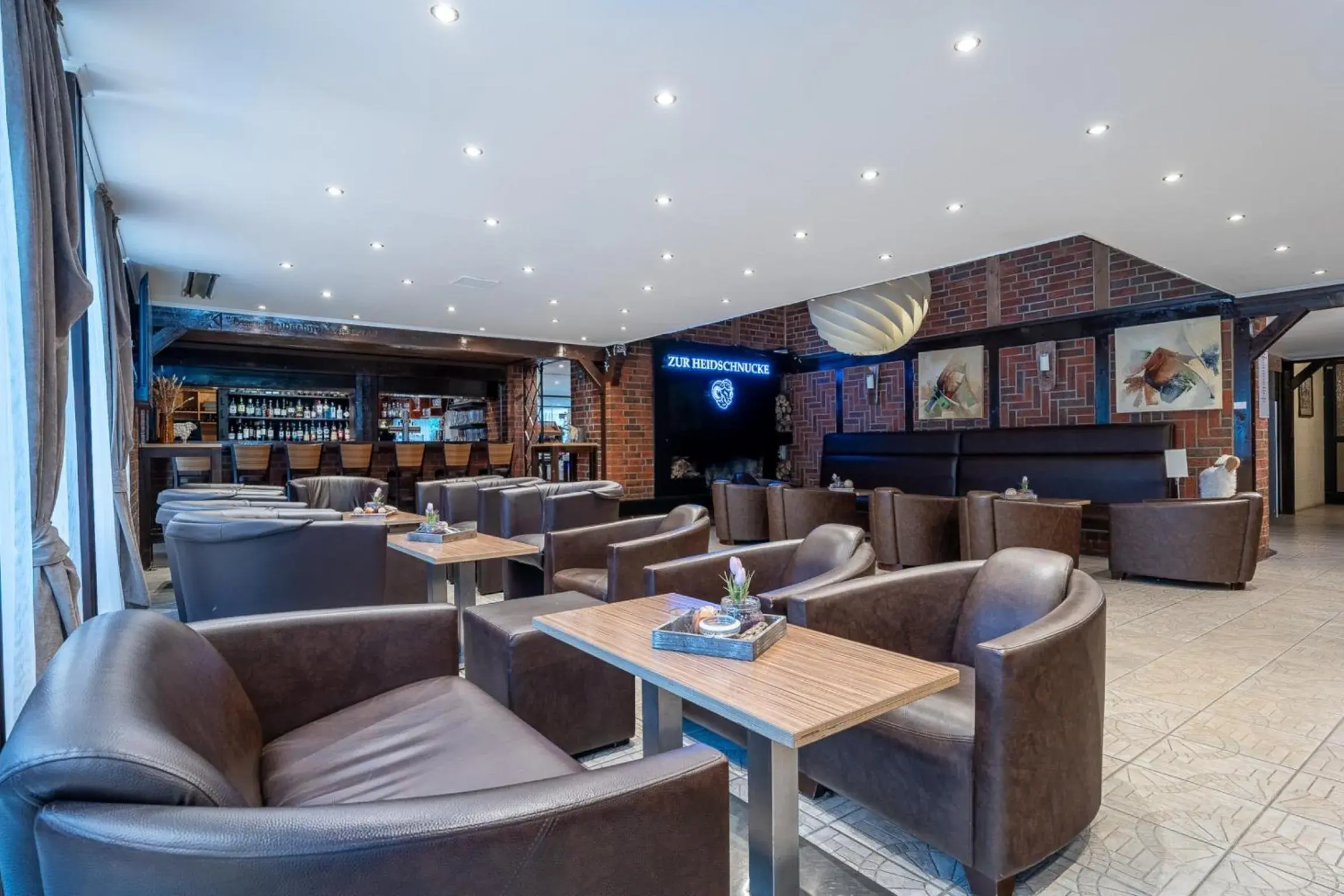 Lounge or bar in Hotel Zur Heidschnucke - Spa & Nature Resort Lounge or bar in Hotel Zur Heidschnucke - Spa & Nature Resort