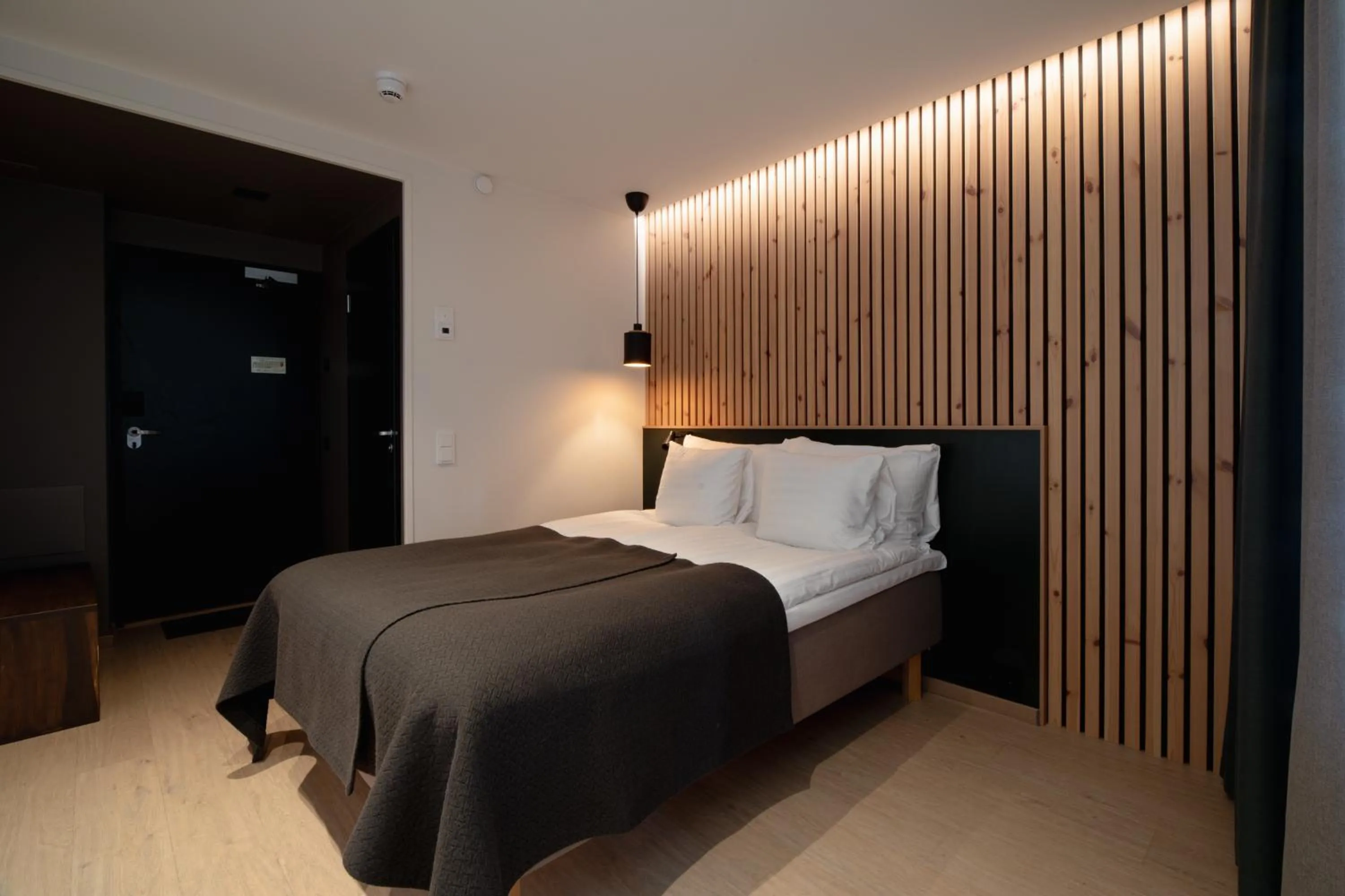 Bed in Haltia Lake Lodge nature boutique hotel & glamping