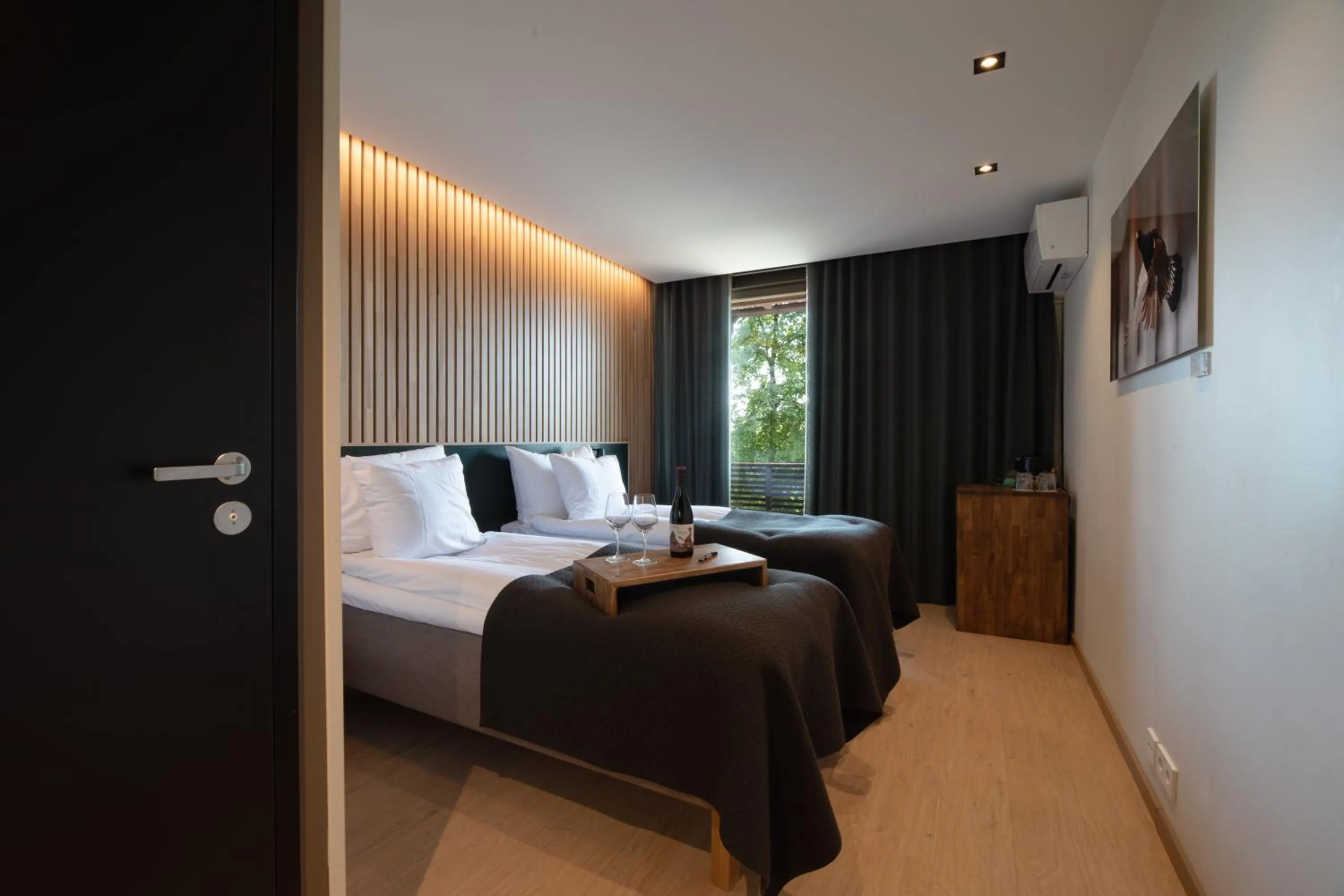 Bed in Haltia Lake Lodge nature boutique hotel & glamping